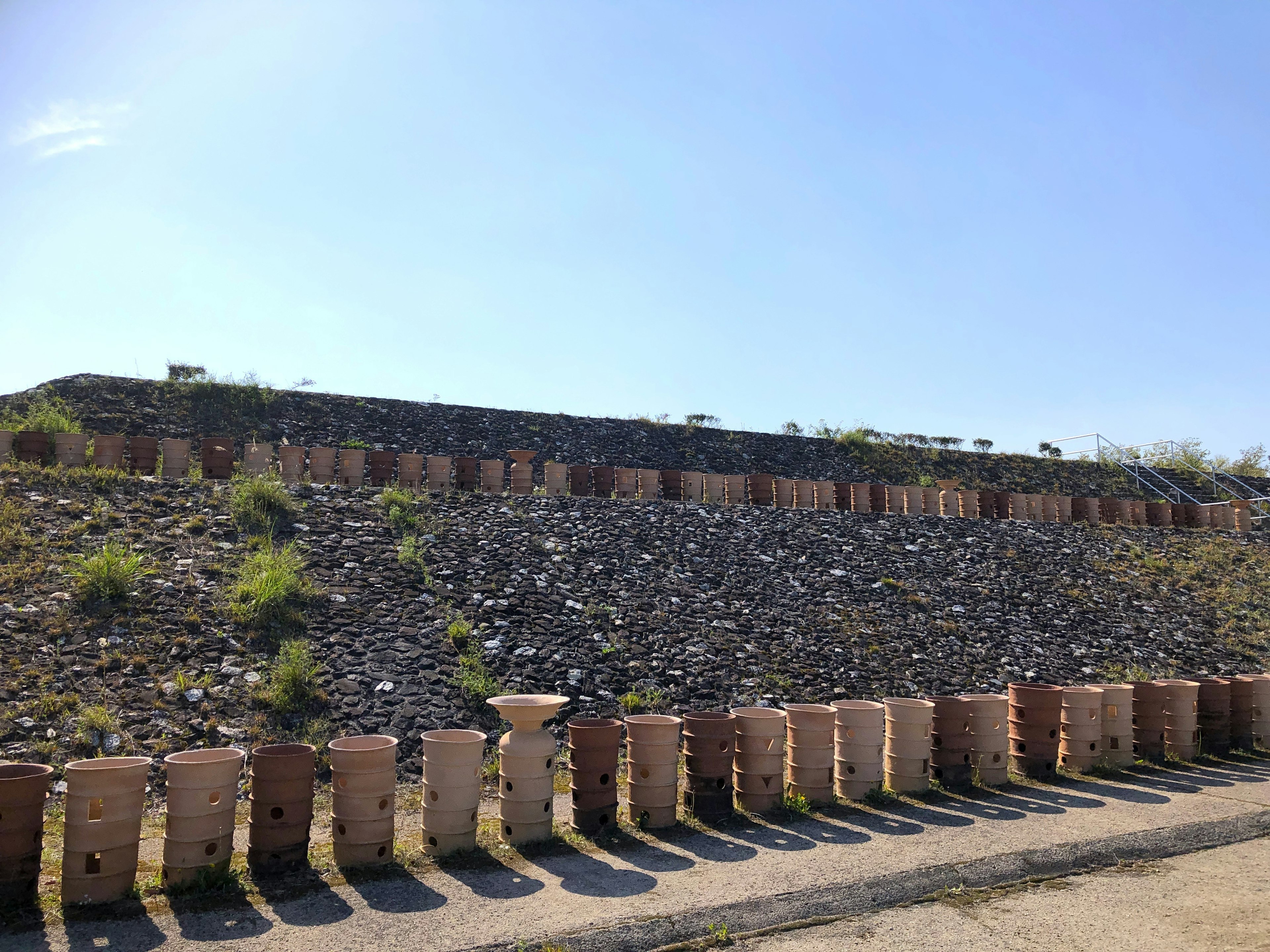 Landscape with a stone and brick wall under a blue sky