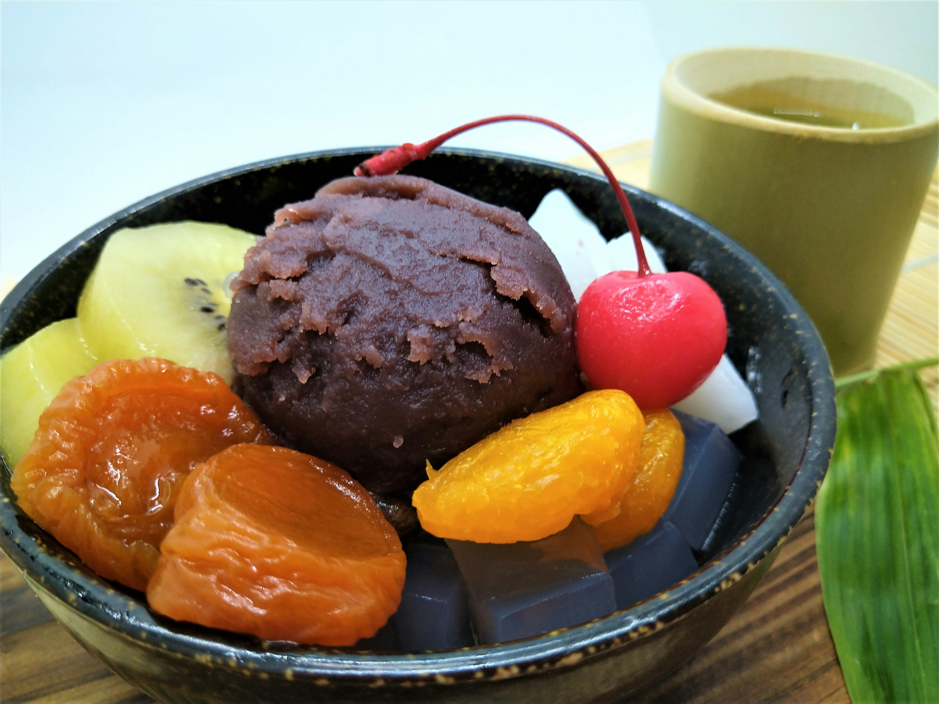 Bowl of dessert featuring sweet red bean paste fruits and jelly