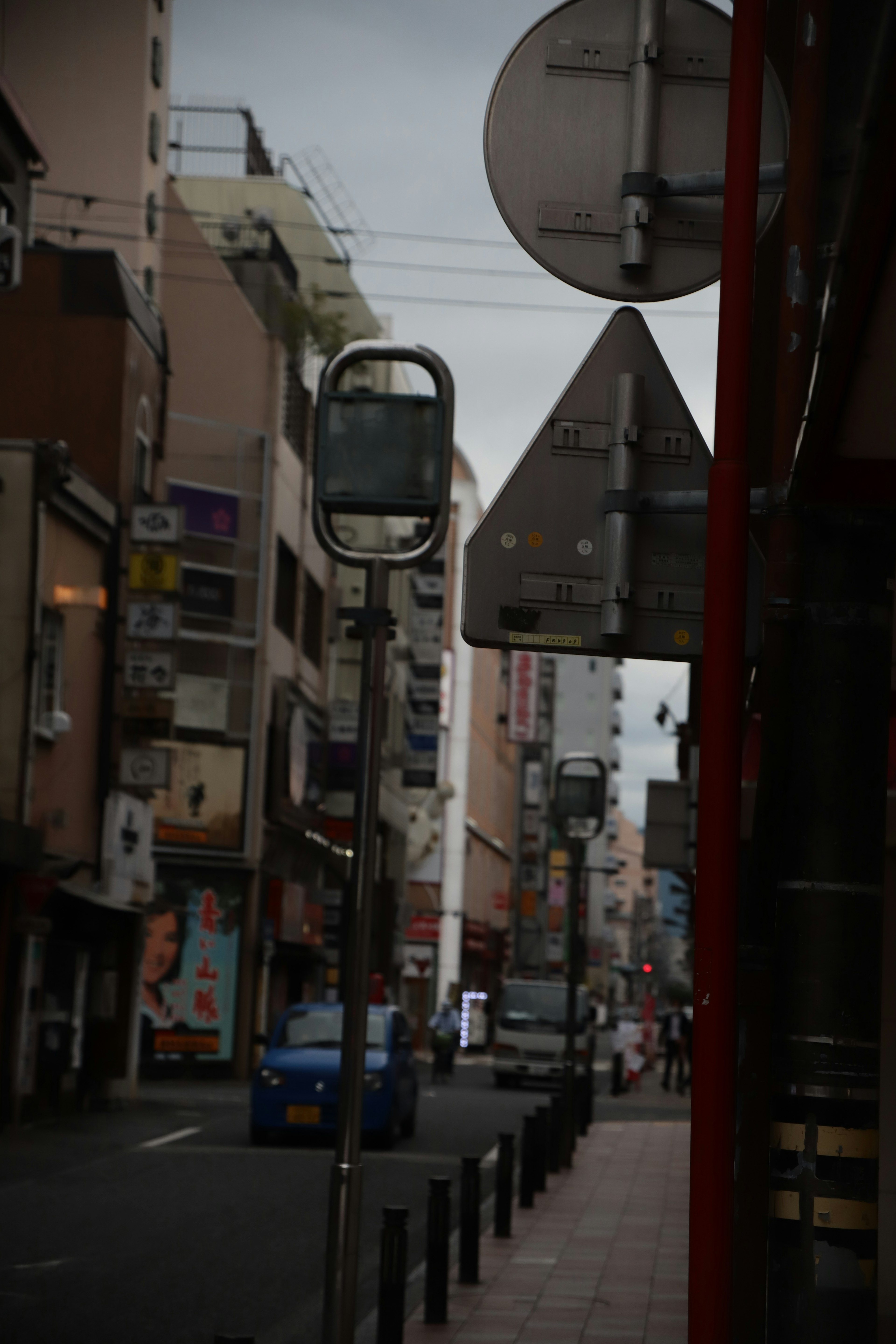 Urban street scene with traffic signs and buildings