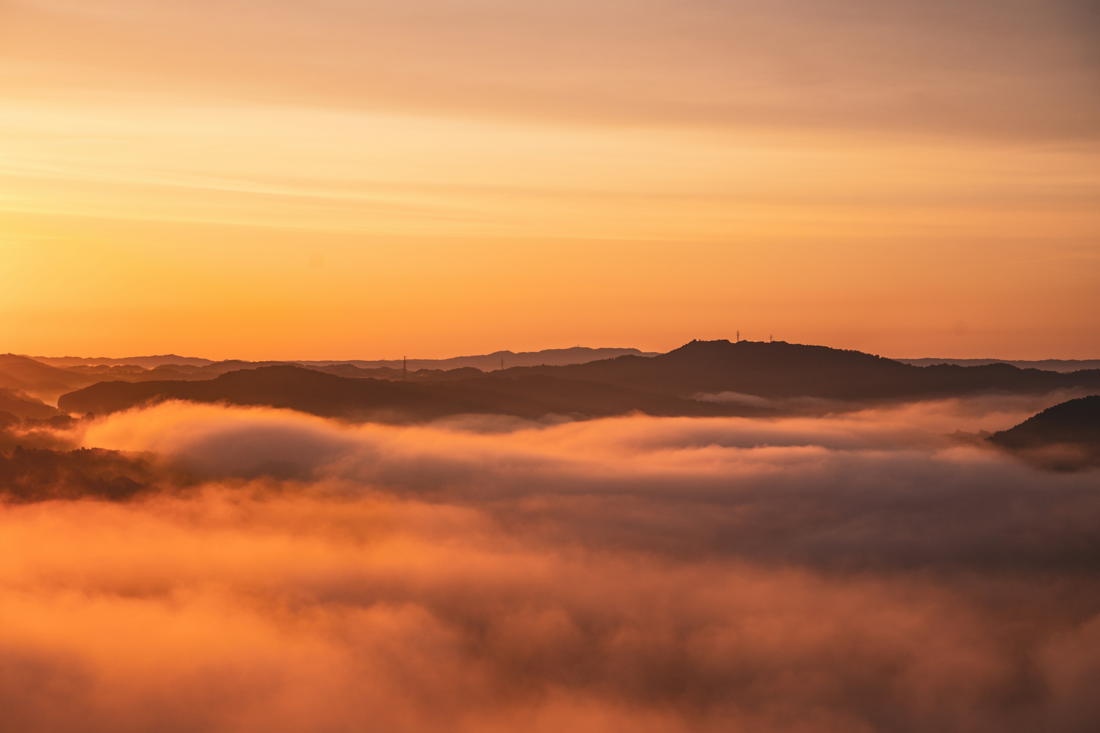 Landscape of mountains and sea of clouds bathed in sunset