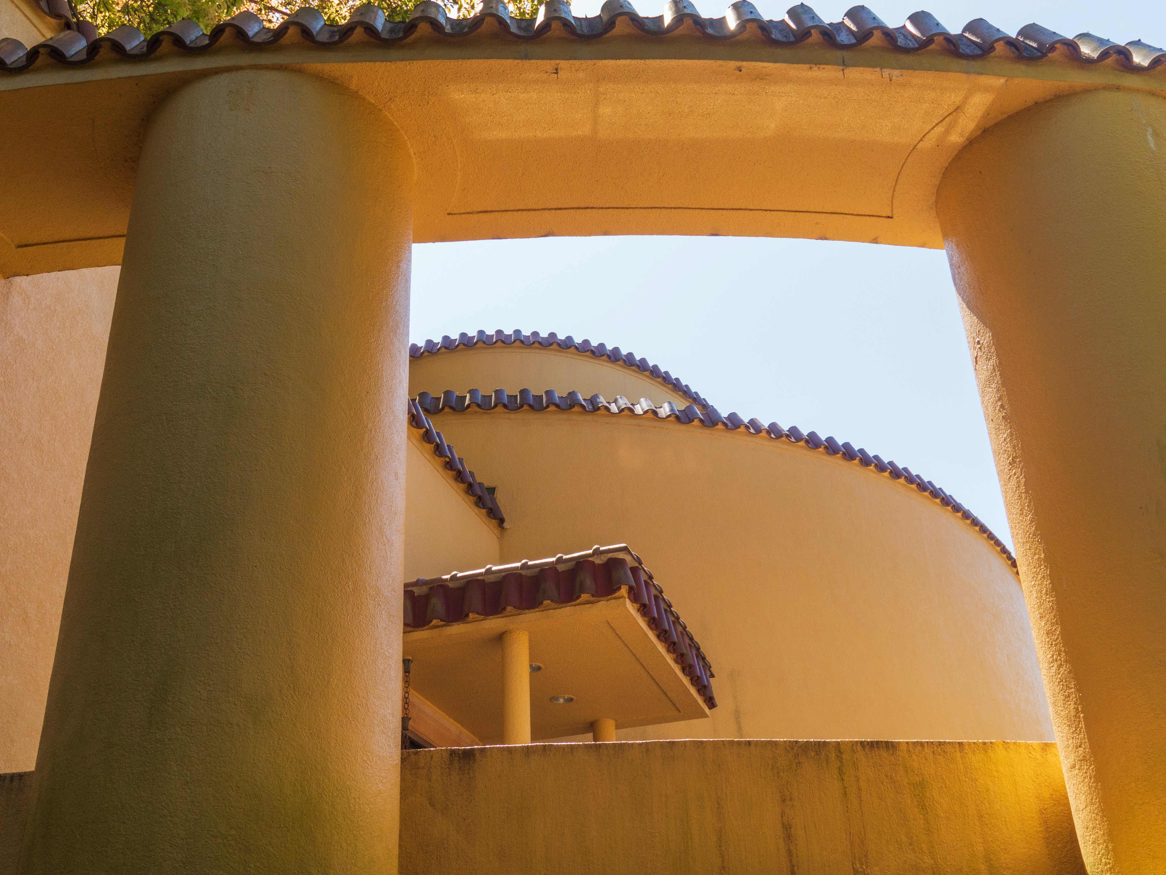 View of a circular building framed by tall columns