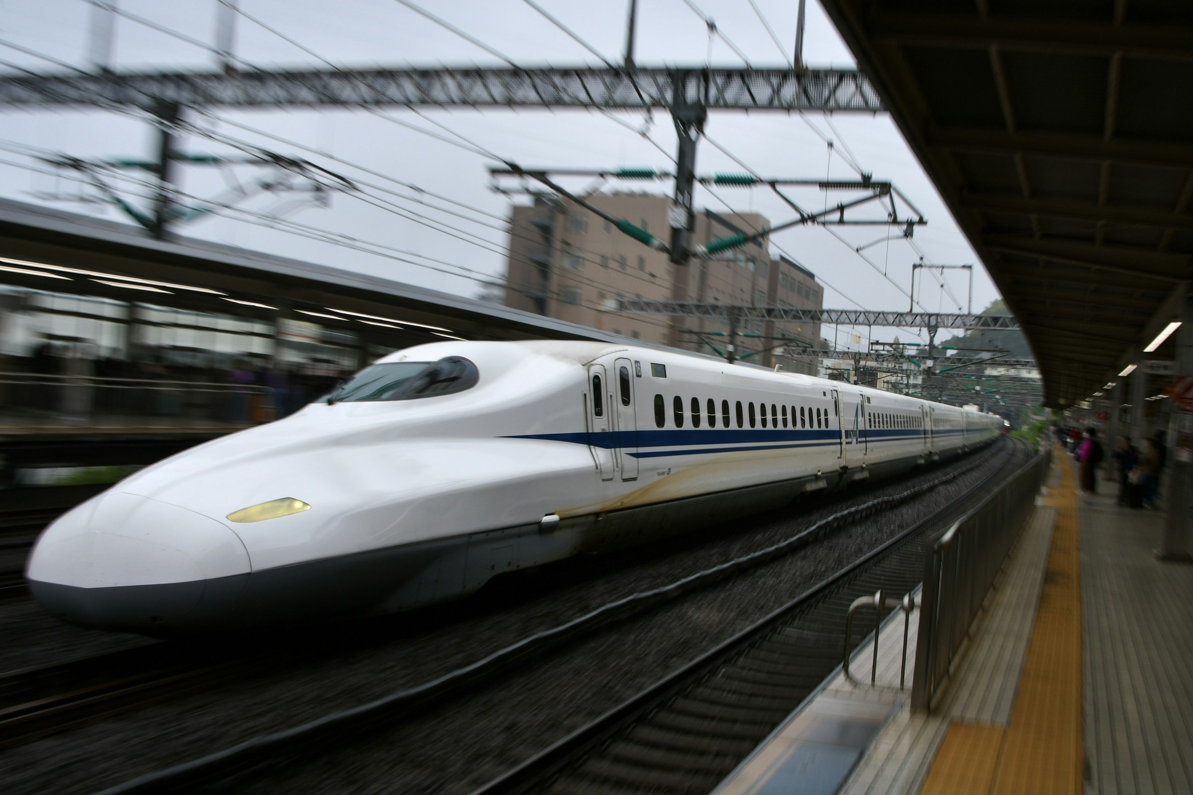 Shinkansen approaching the station with a dynamic motion