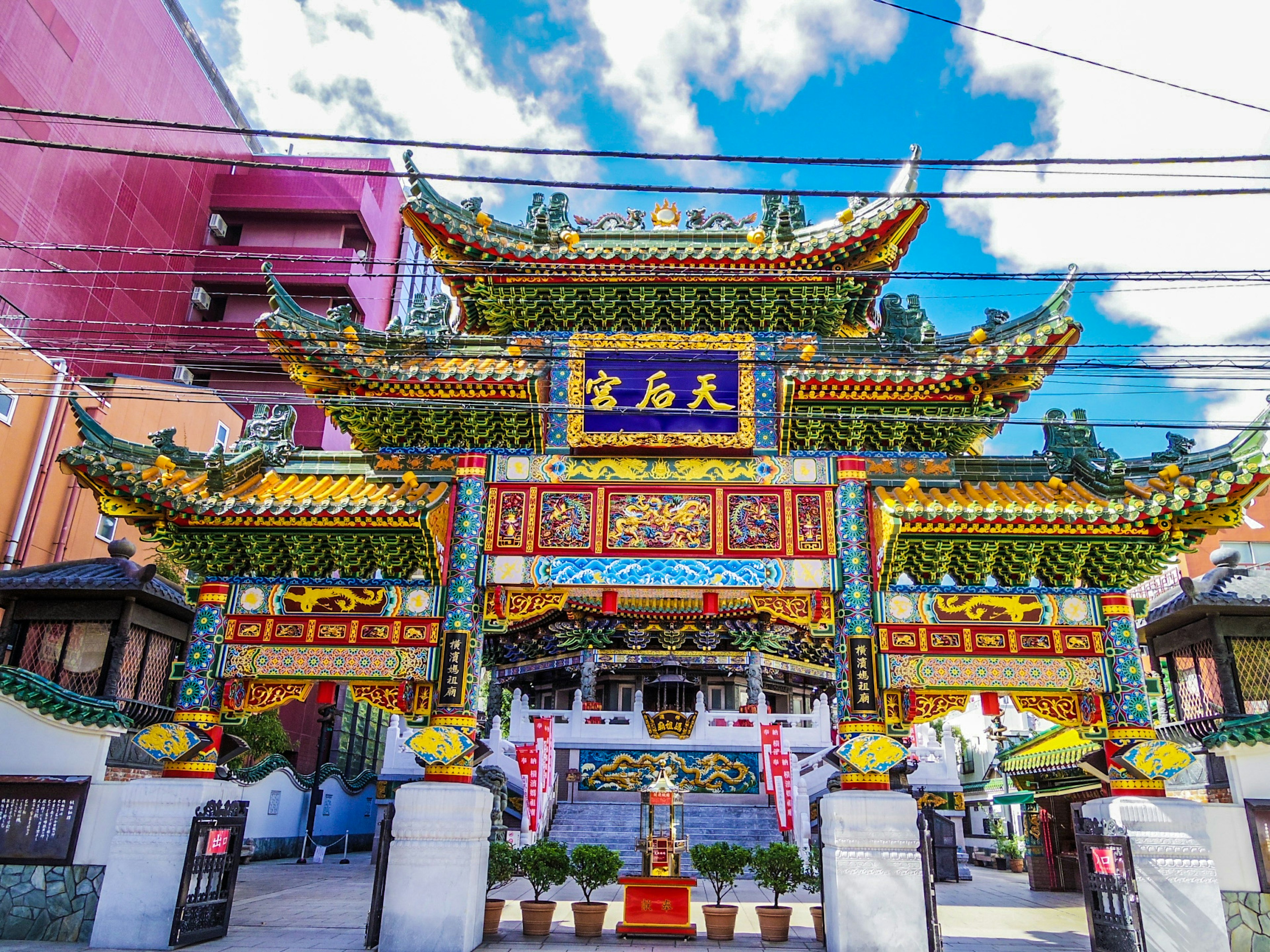 Colorful Chinese temple entrance with decorative roofs and intricate carvings