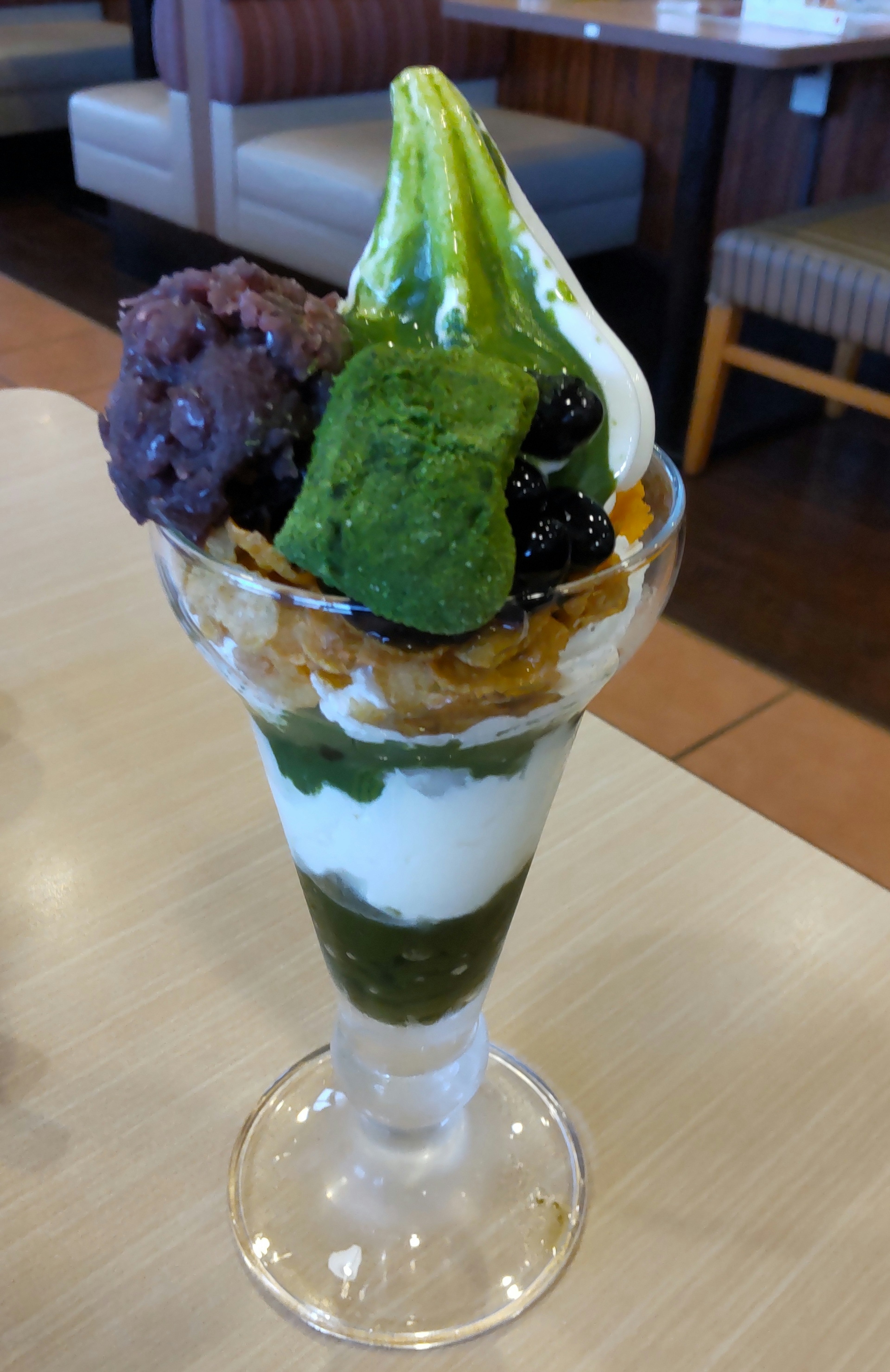 Matcha parfait topped with red bean and matcha ice cream