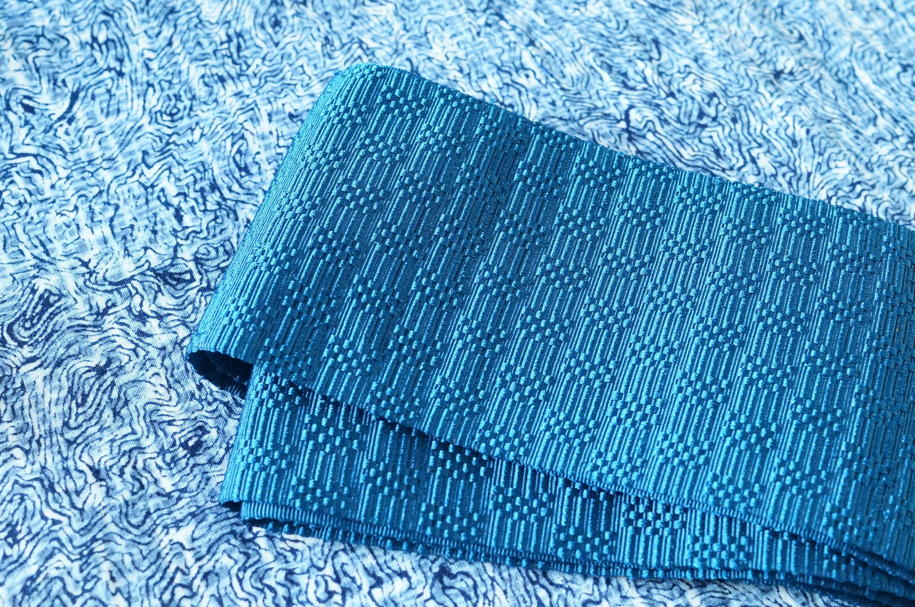 Folded textured fabric in shades of blue