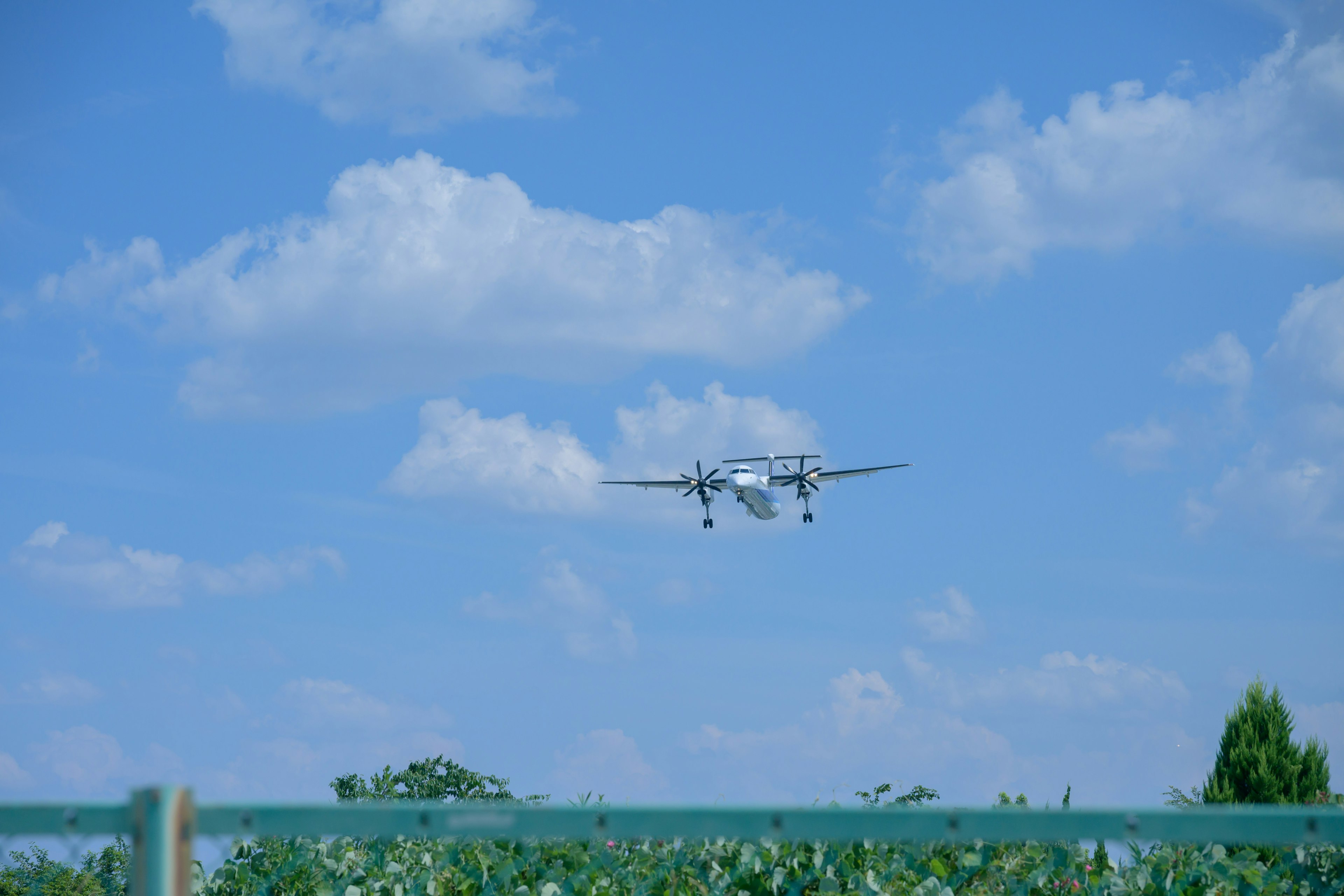 Image of a drone flying under a blue sky