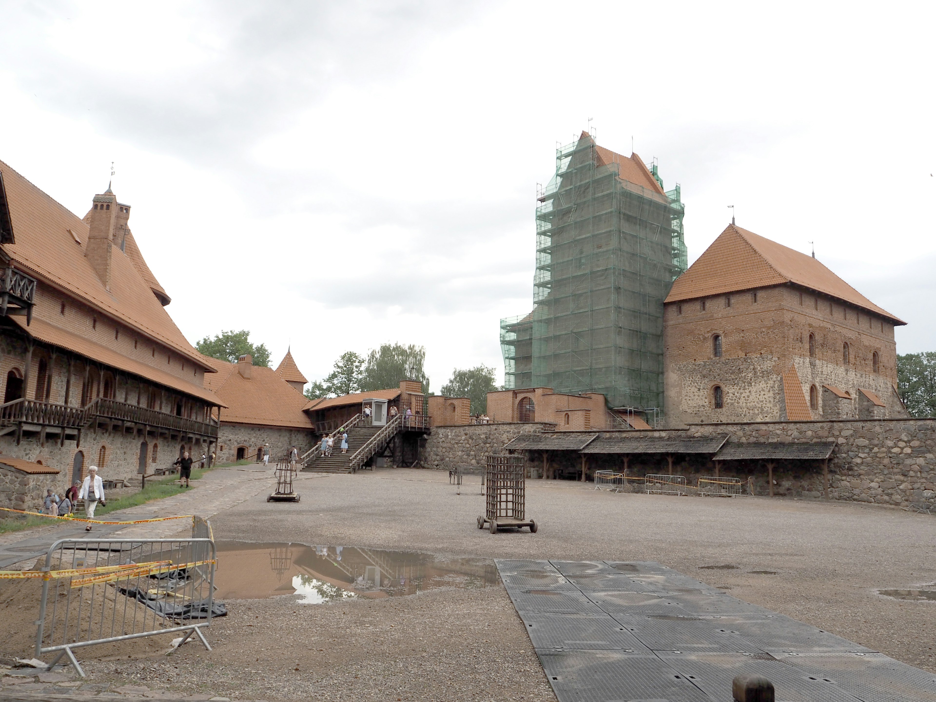 Medieval castle under renovation with surrounding courtyard