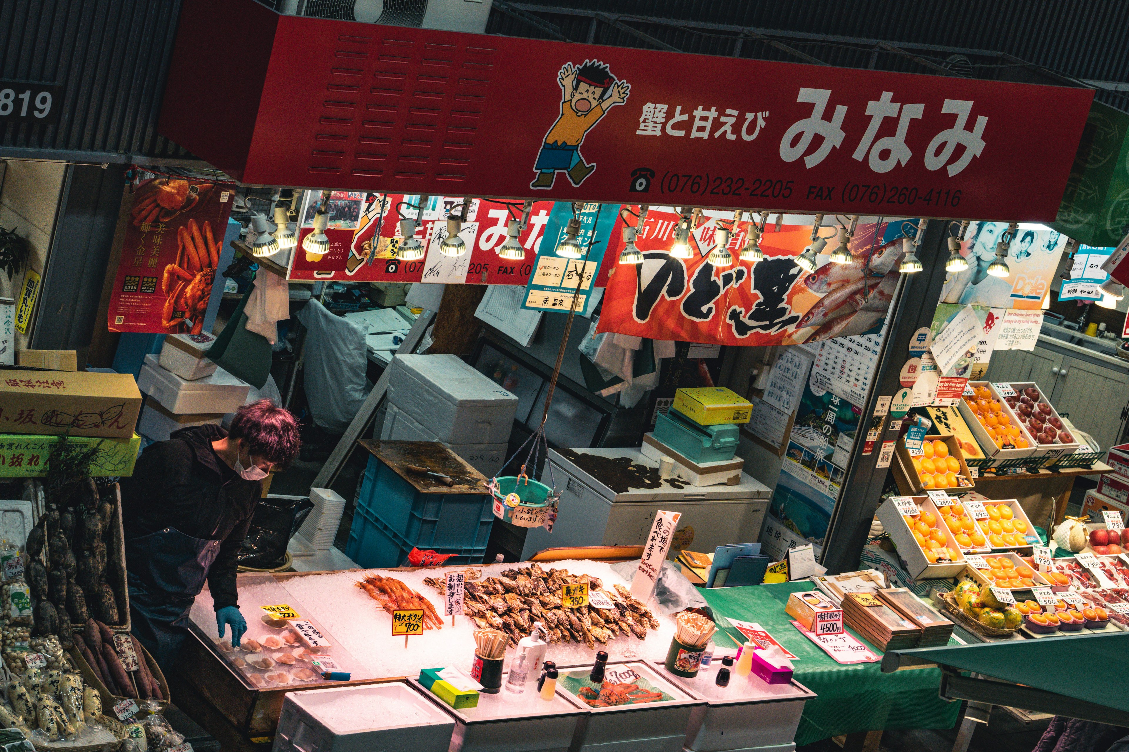 Vibrant market stall displaying fresh seafood and various ingredients