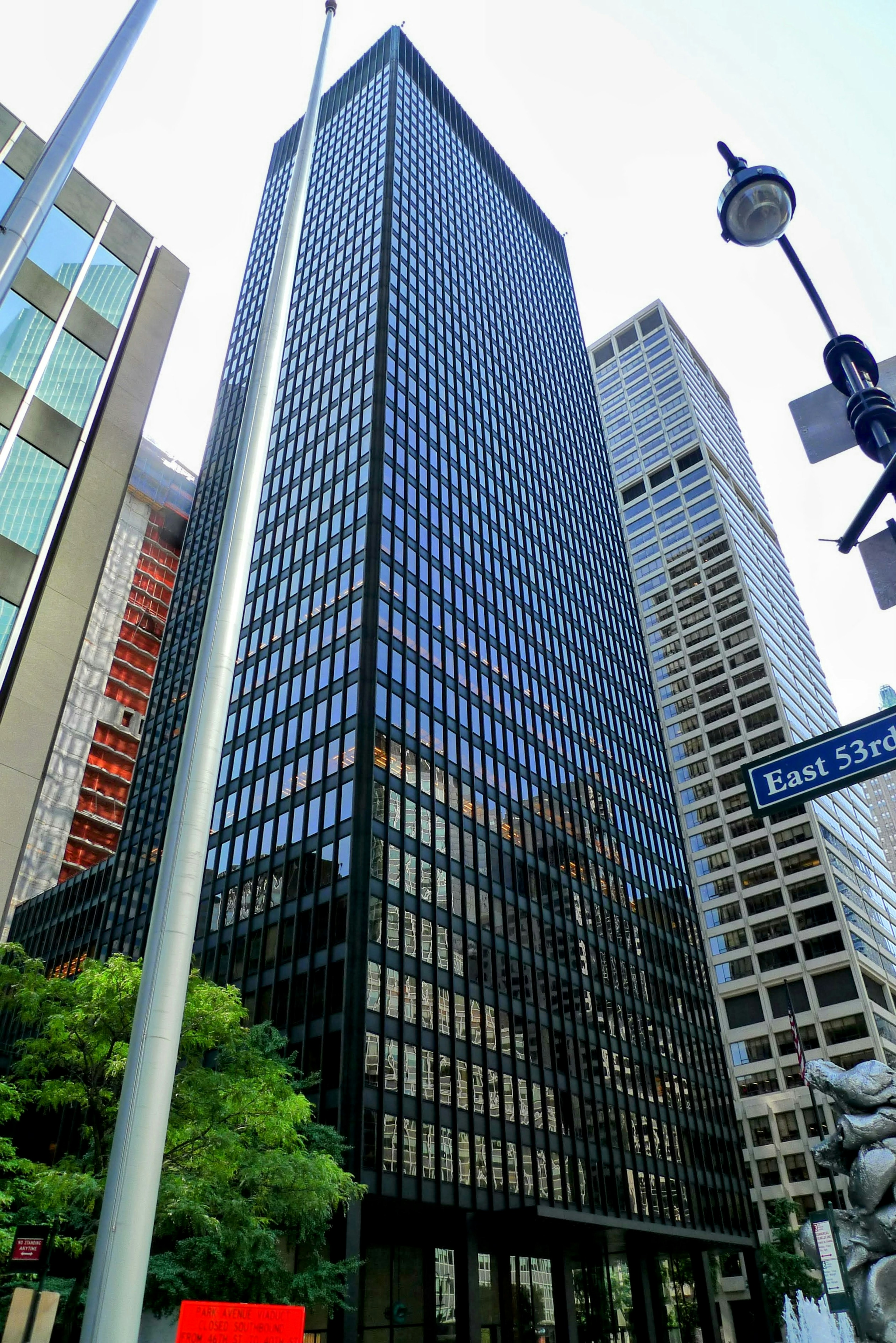 Urban landscape featuring a tall glass skyscraper