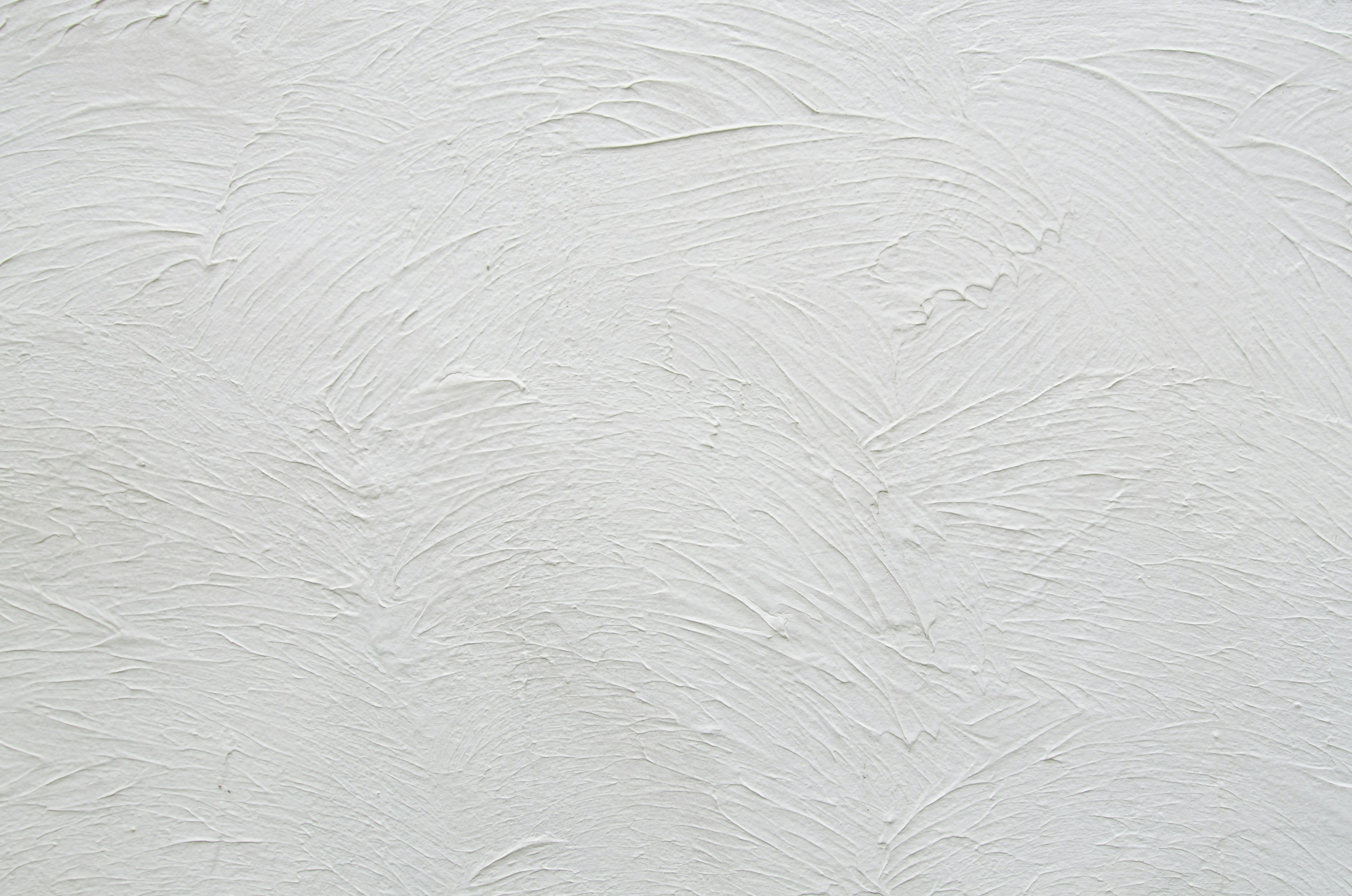 Mur texturé blanc avec des variations subtiles