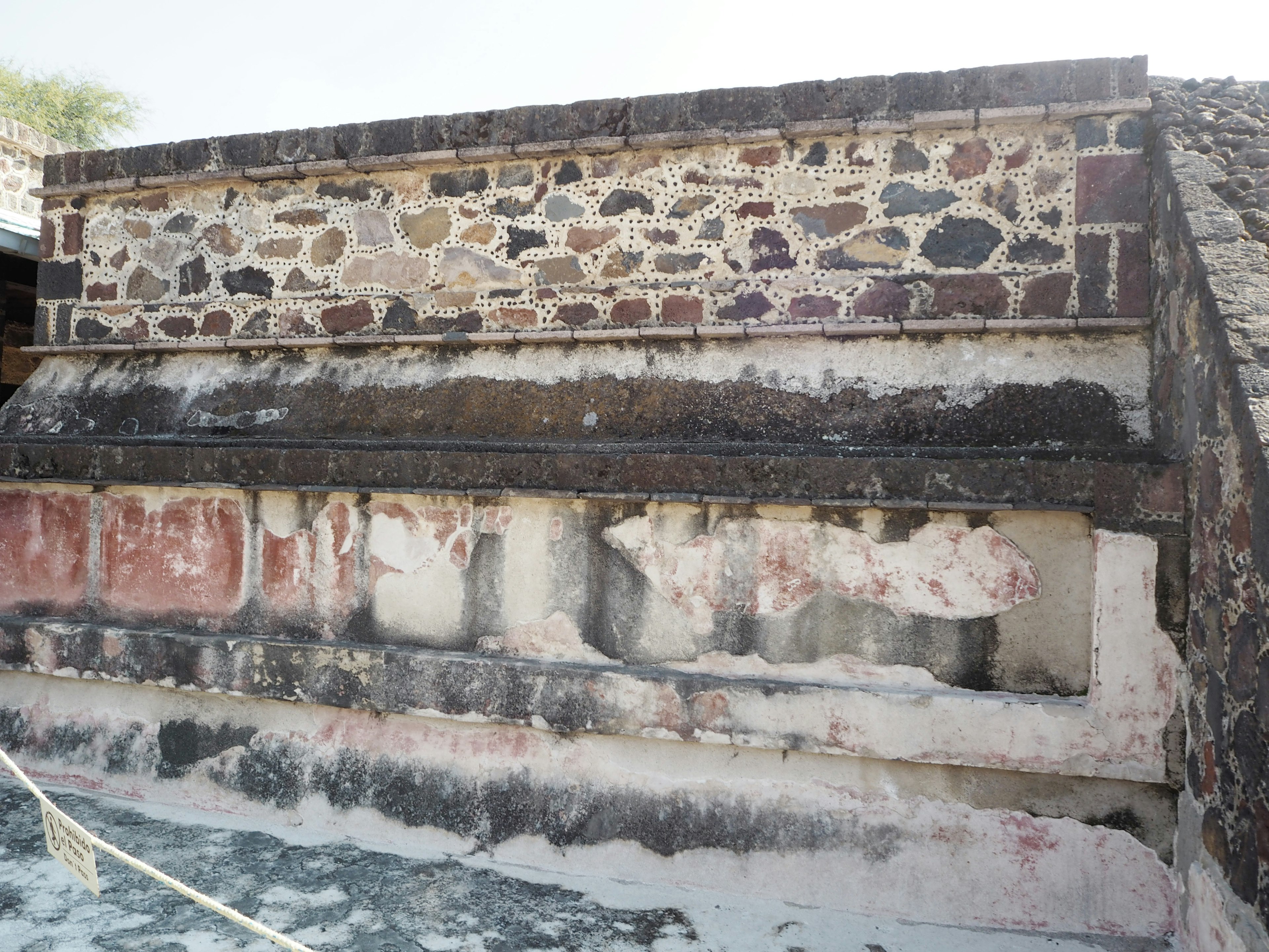 Ancient stone structure featuring faded walls and decorative elements