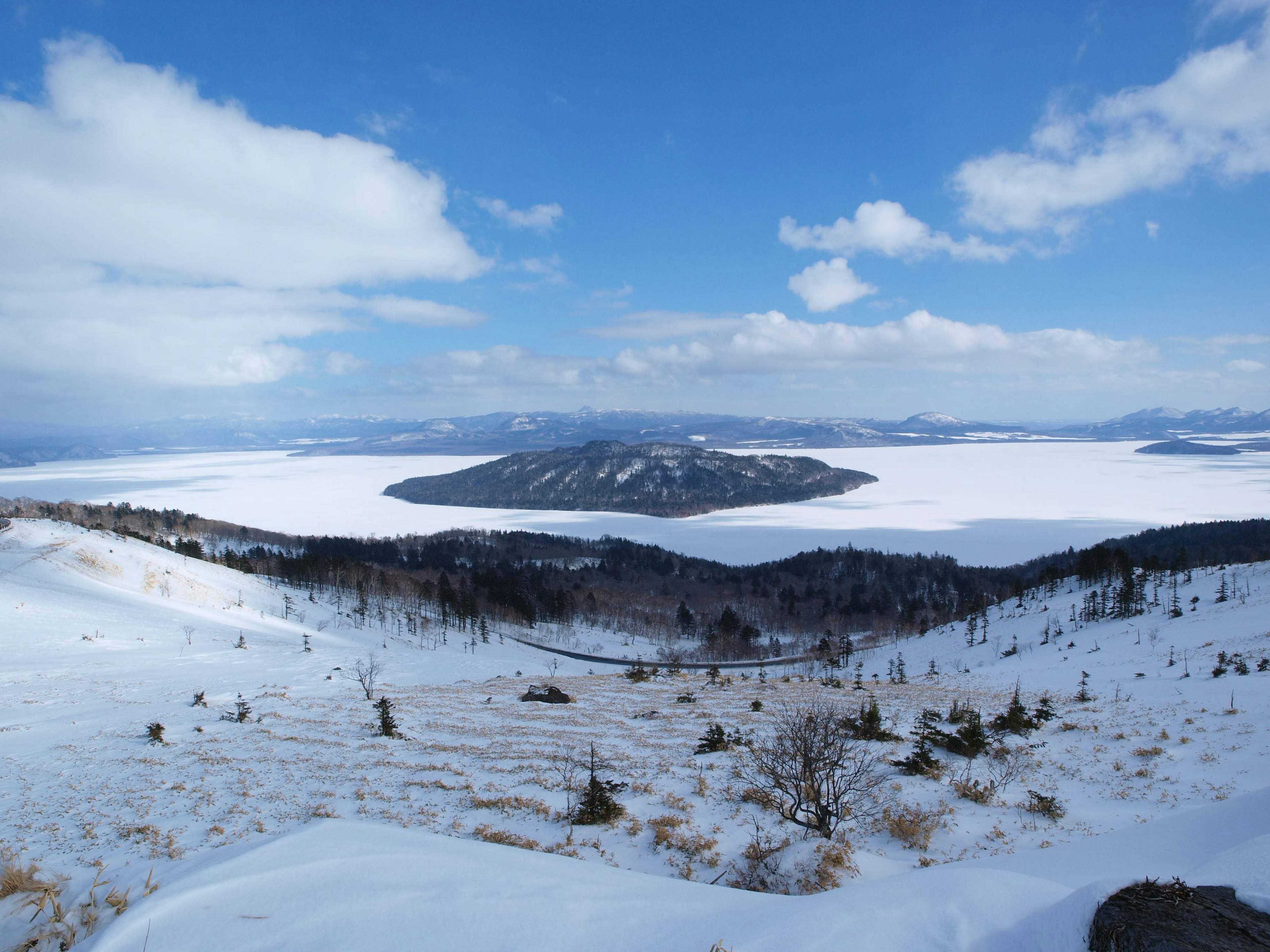 Scenic view of snow-covered mountains and a lake