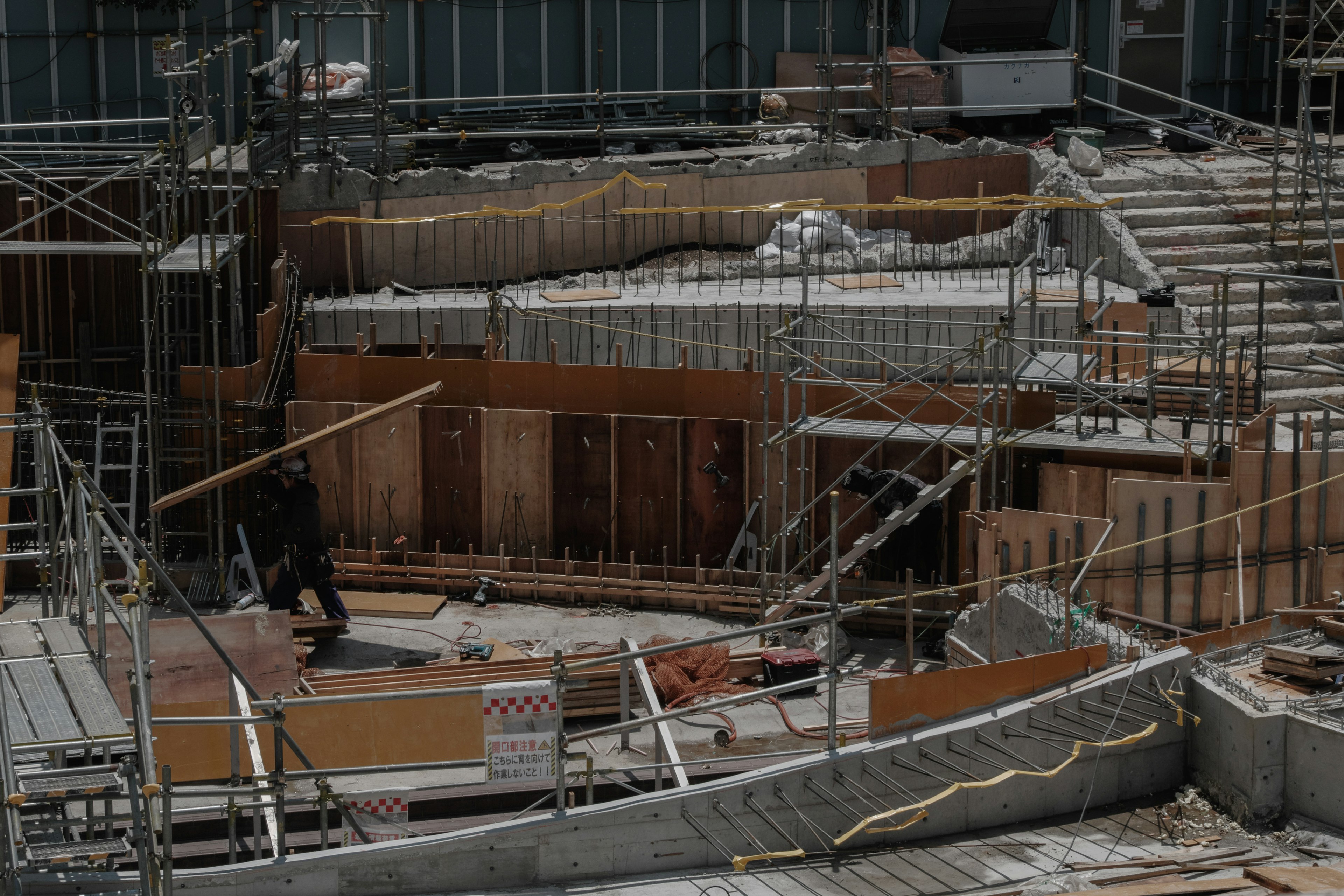 Construction site featuring scaffolding and wooden structures