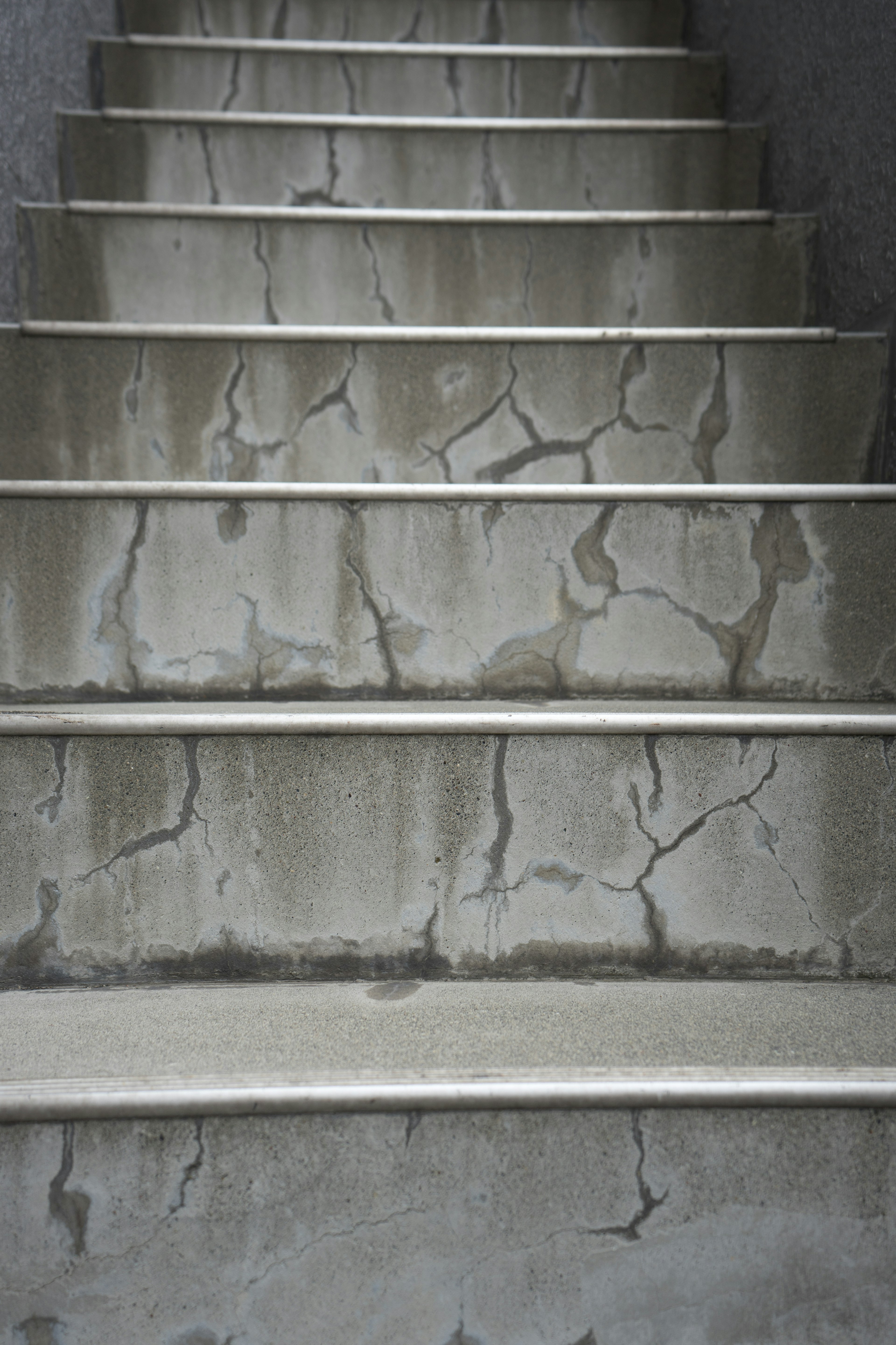 Concrete stairs showing visible cracks and wear