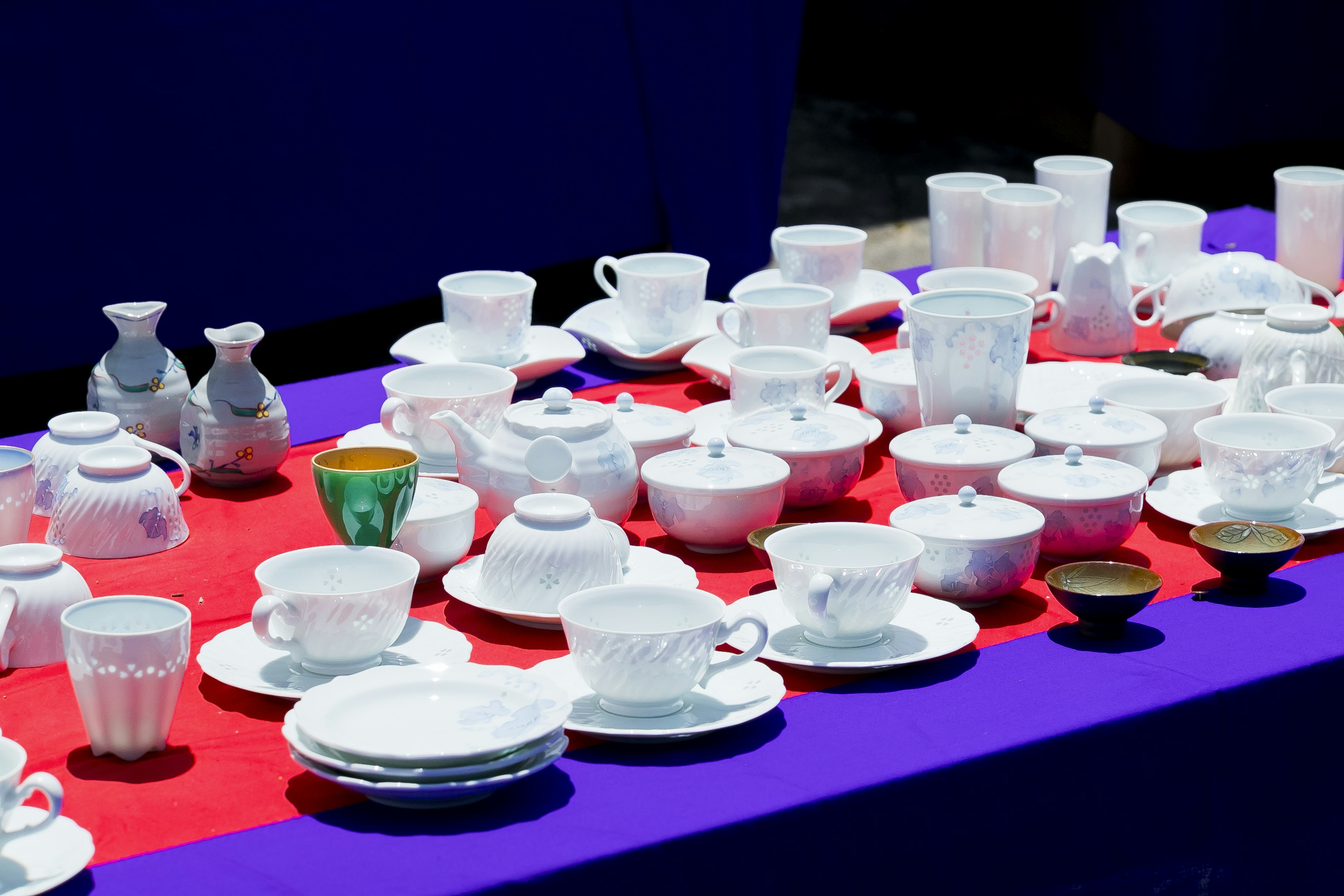 A variety of white ceramic dishes displayed on a table