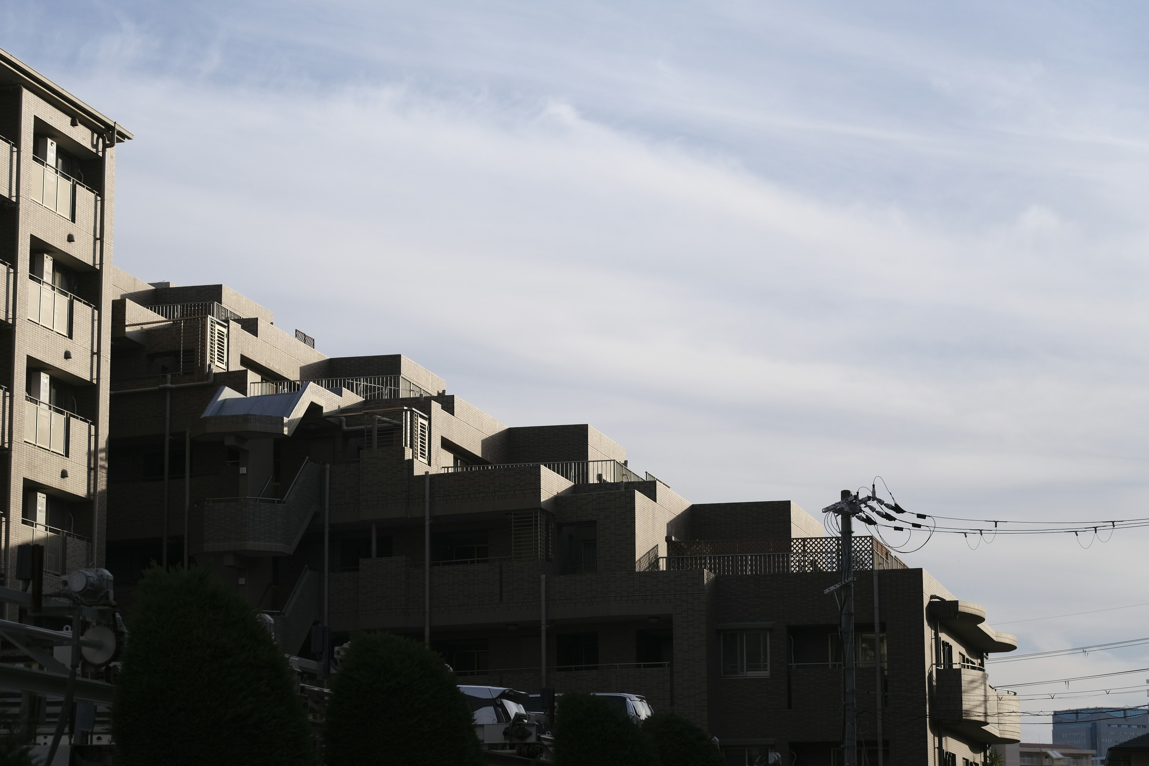 Silhouette of high-rise buildings against a blue sky