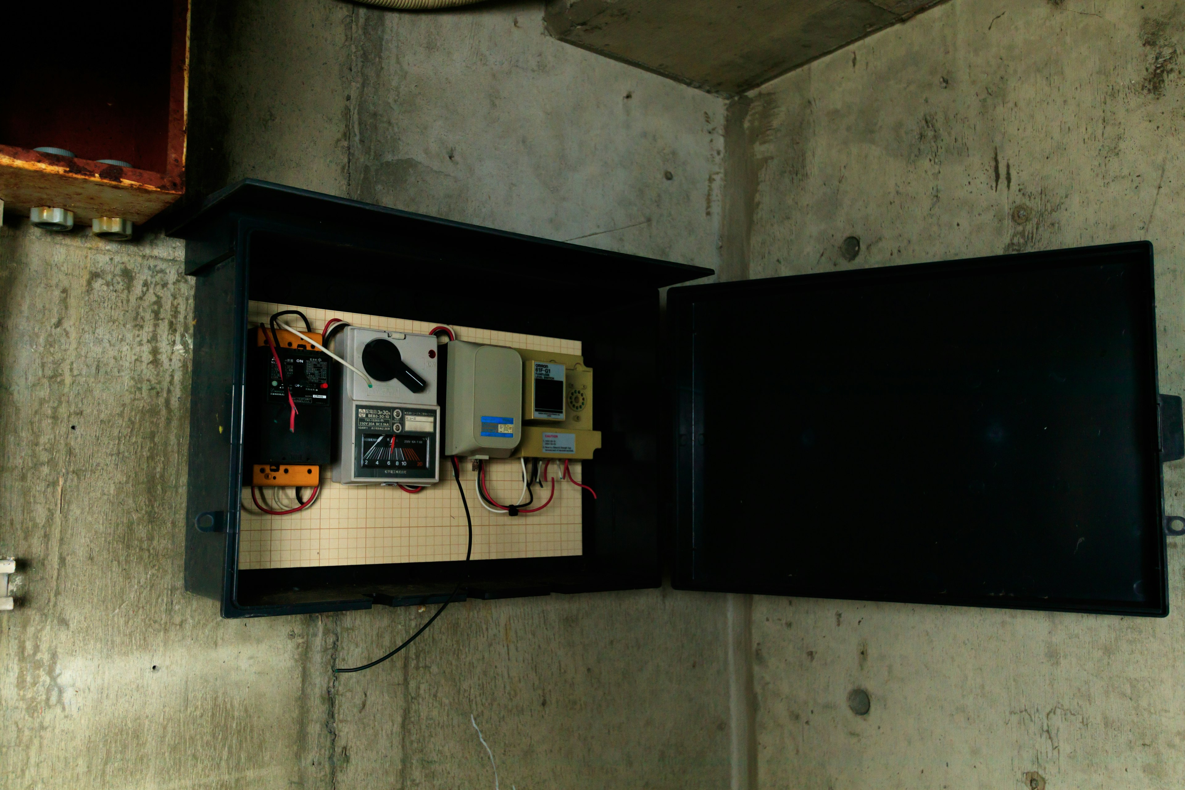 Black safe with electronic devices and wiring inside