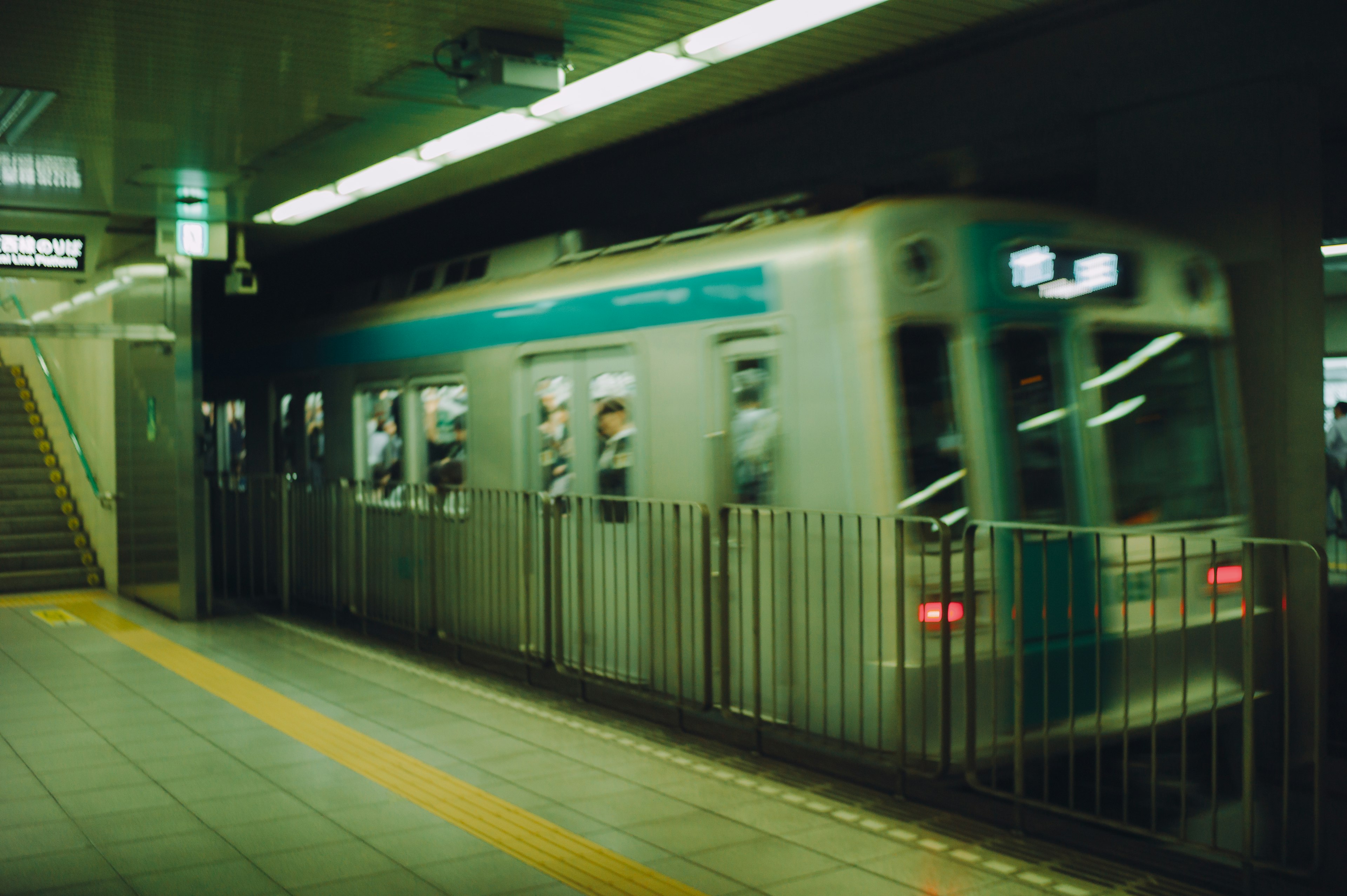 Blurred image of a train departing from a station