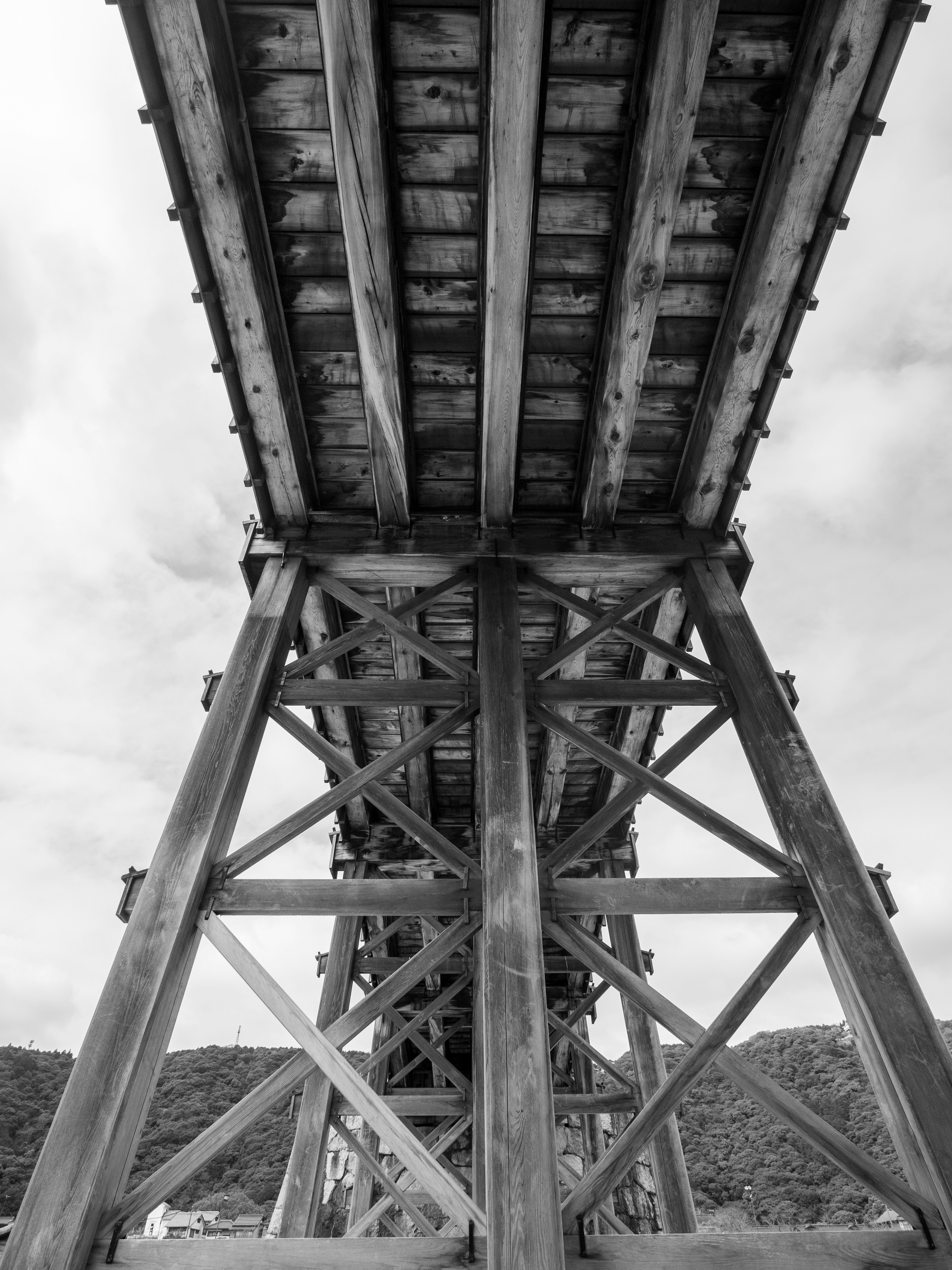 Detailed view of a wooden bridge structure from underneath