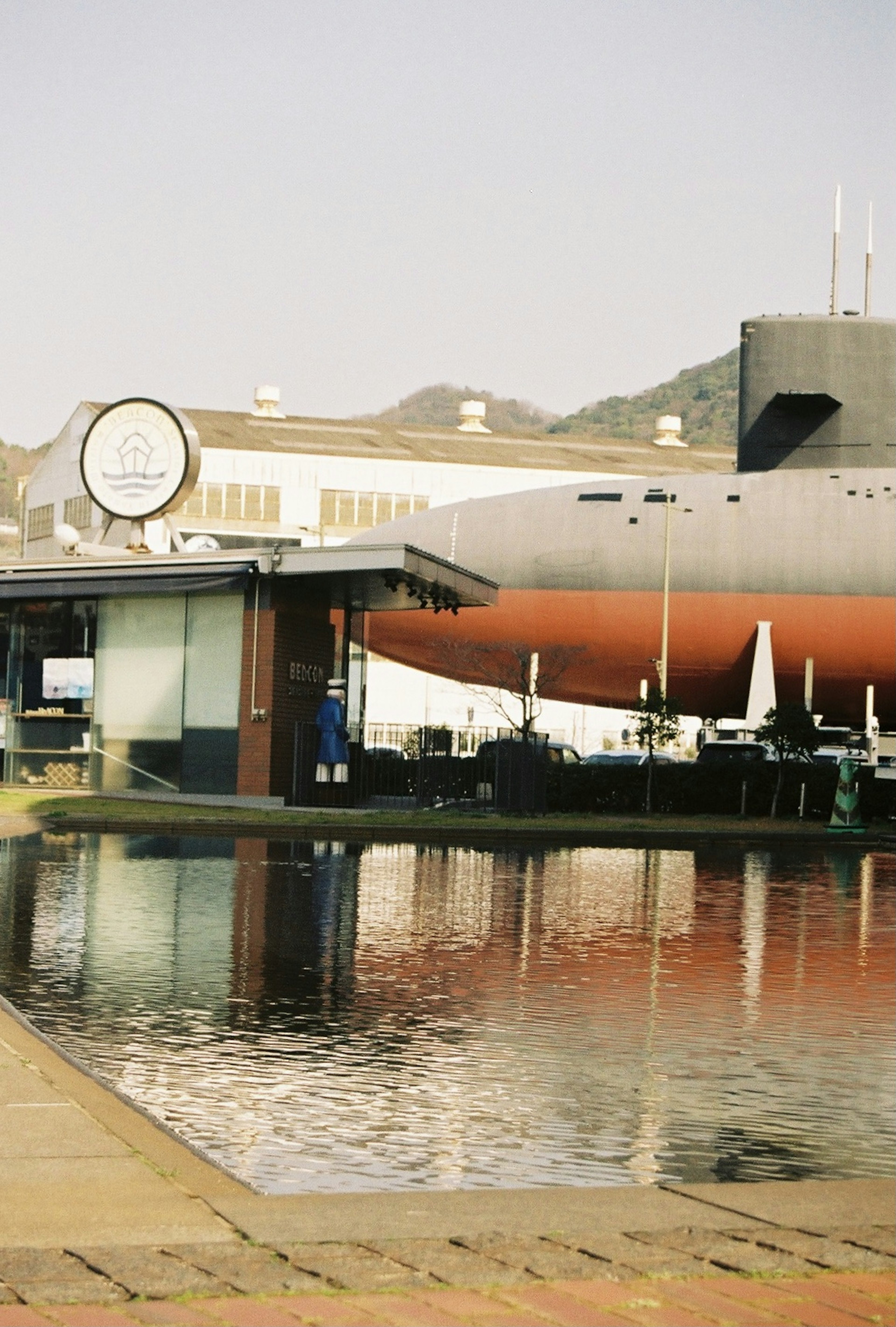 Landscape with building and clock reflected in the water