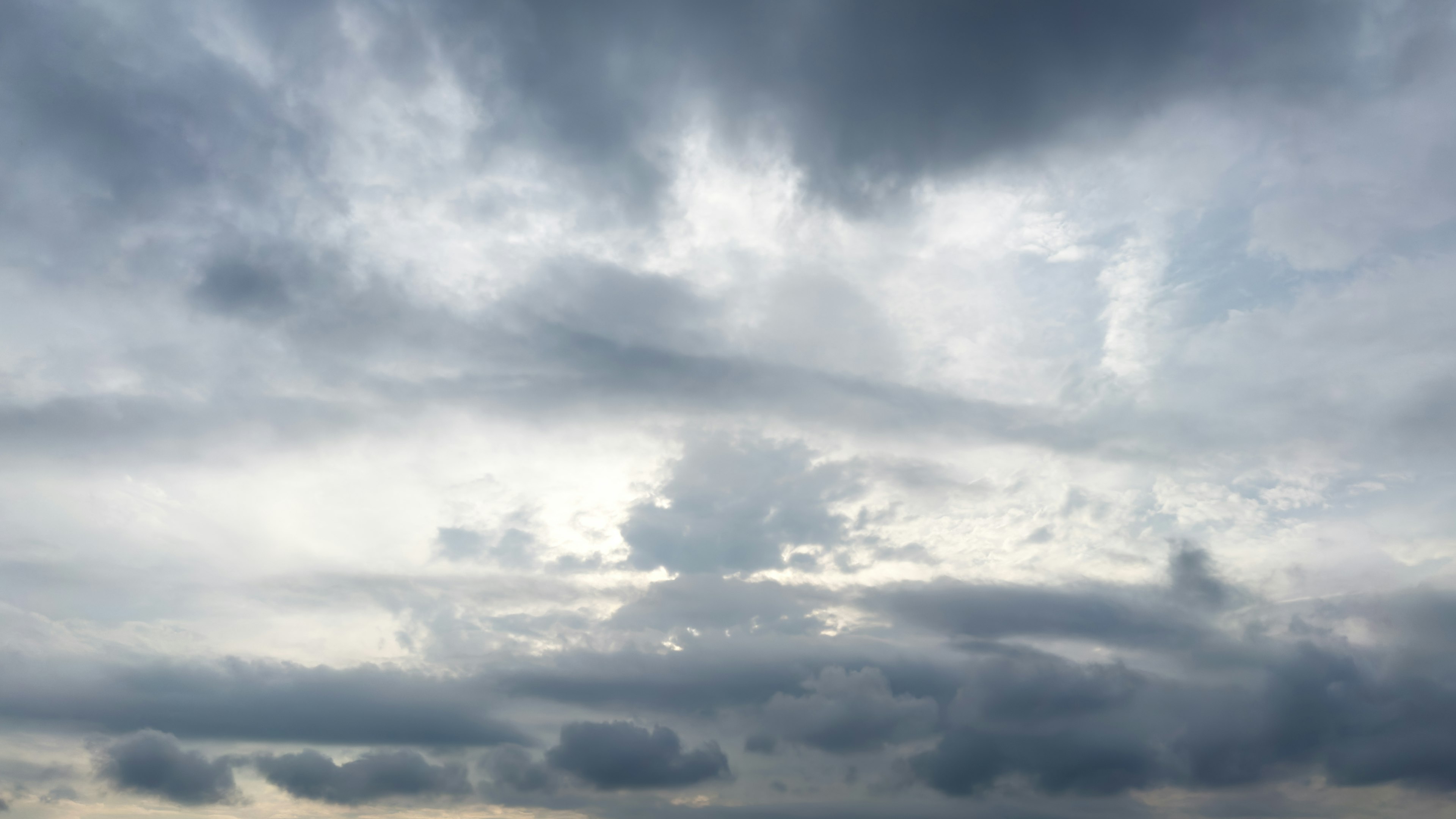 Overcast sky with scattered clouds and soft light