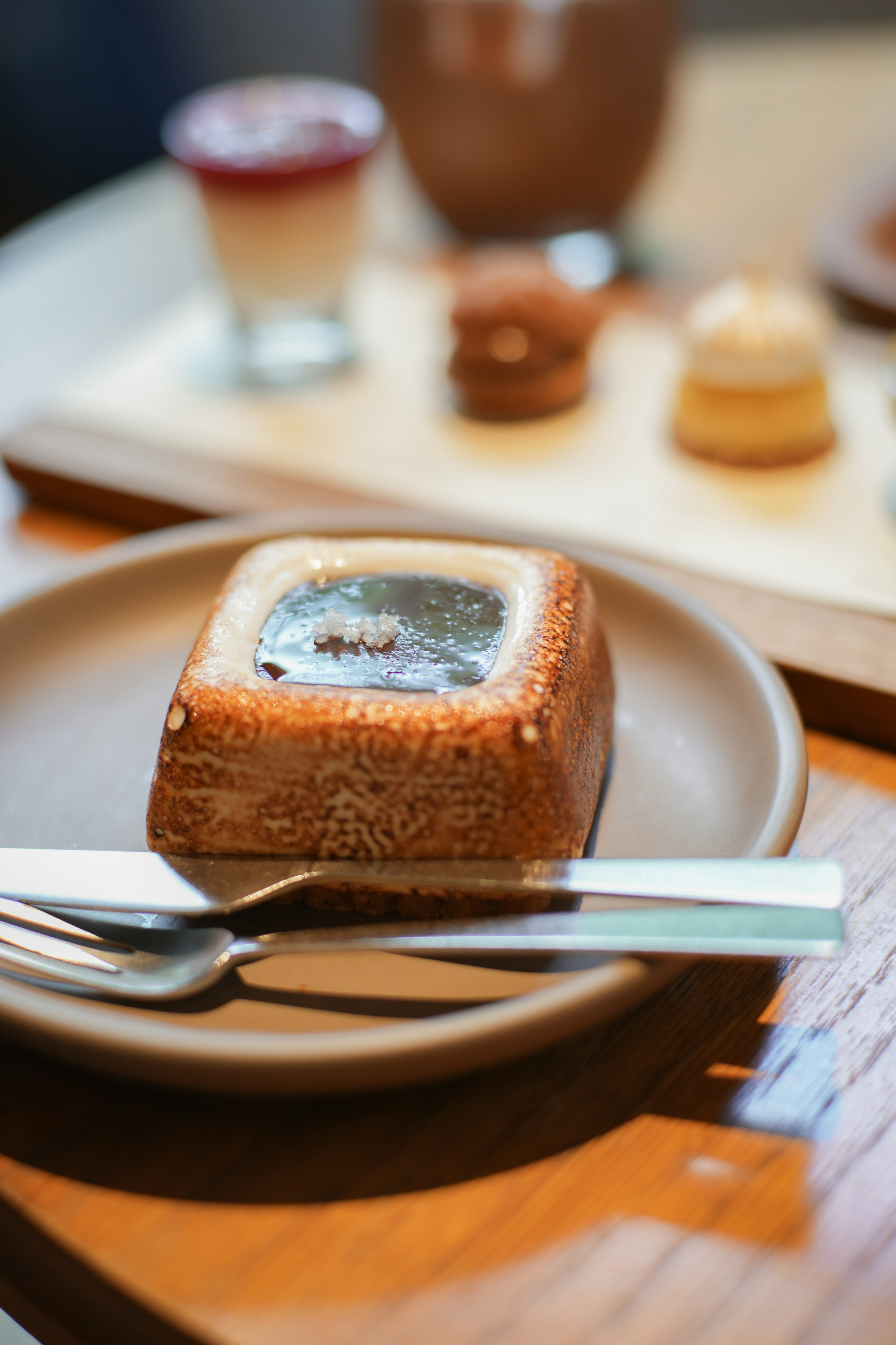 Delicious dessert on a plate with a spoon beside it