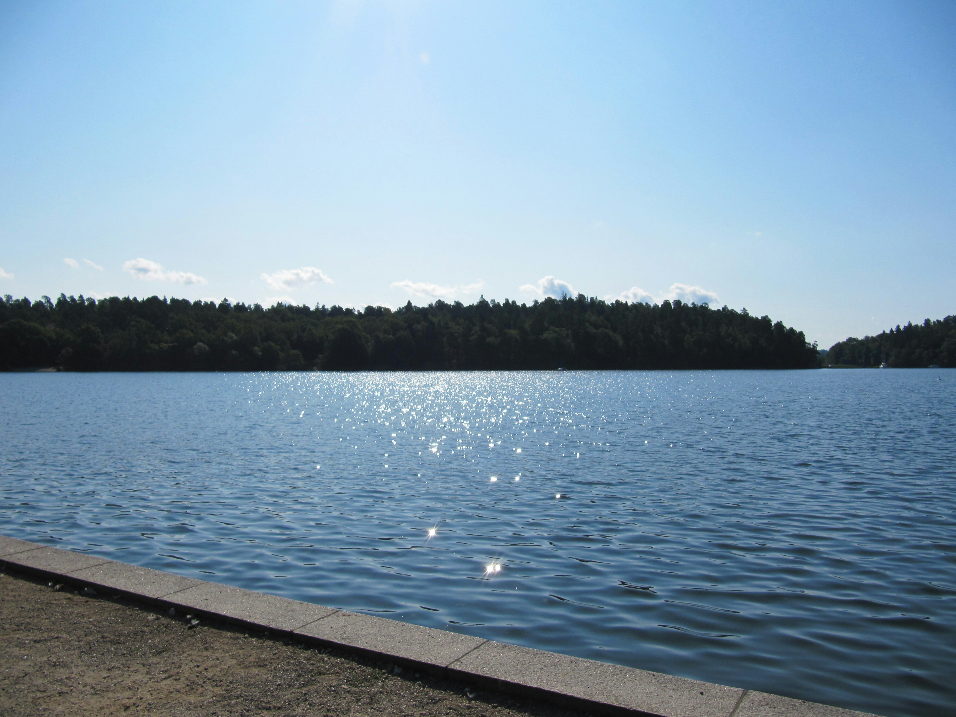 Serene lake reflecting the blue sky