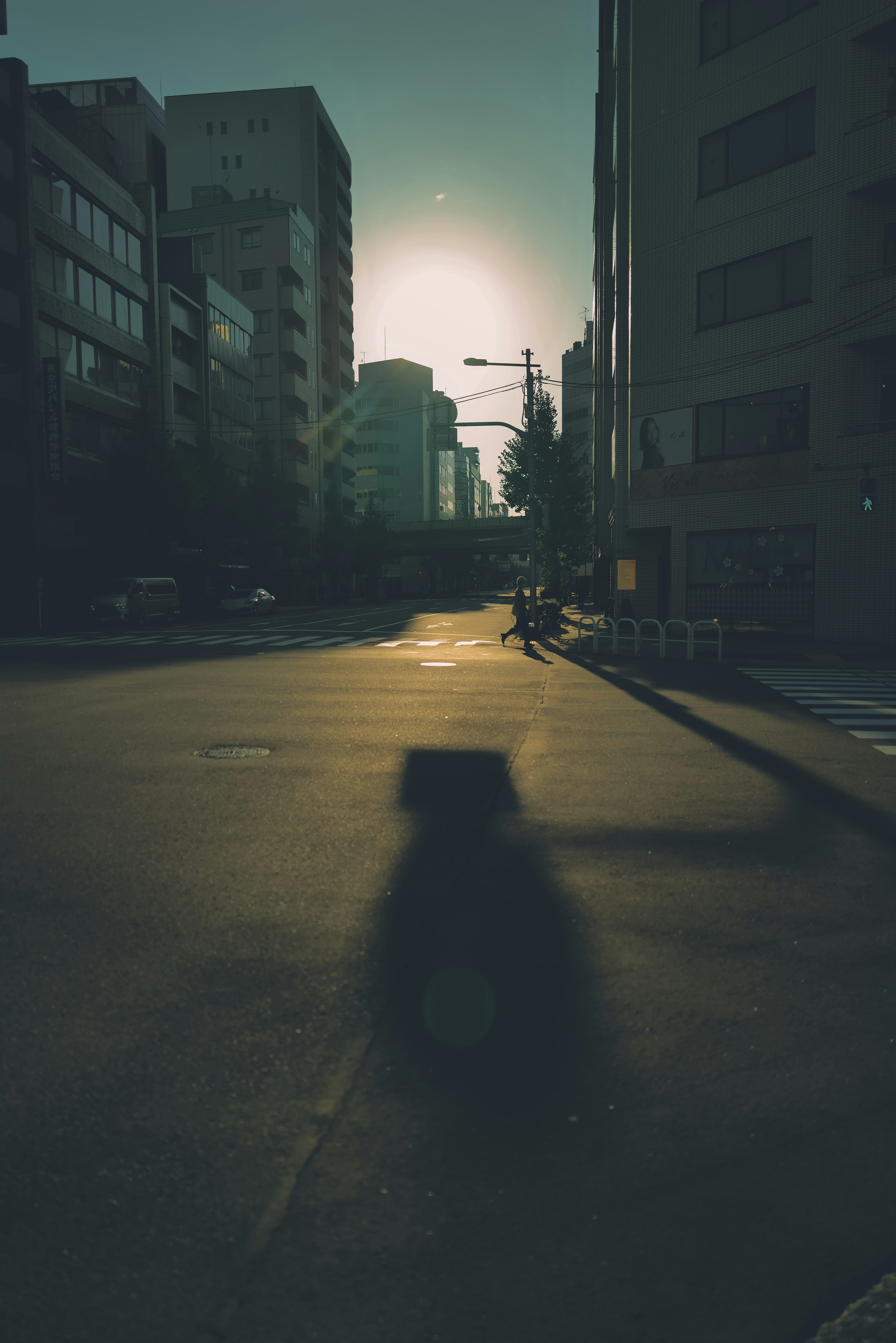 City street at dusk with shadows and buildings