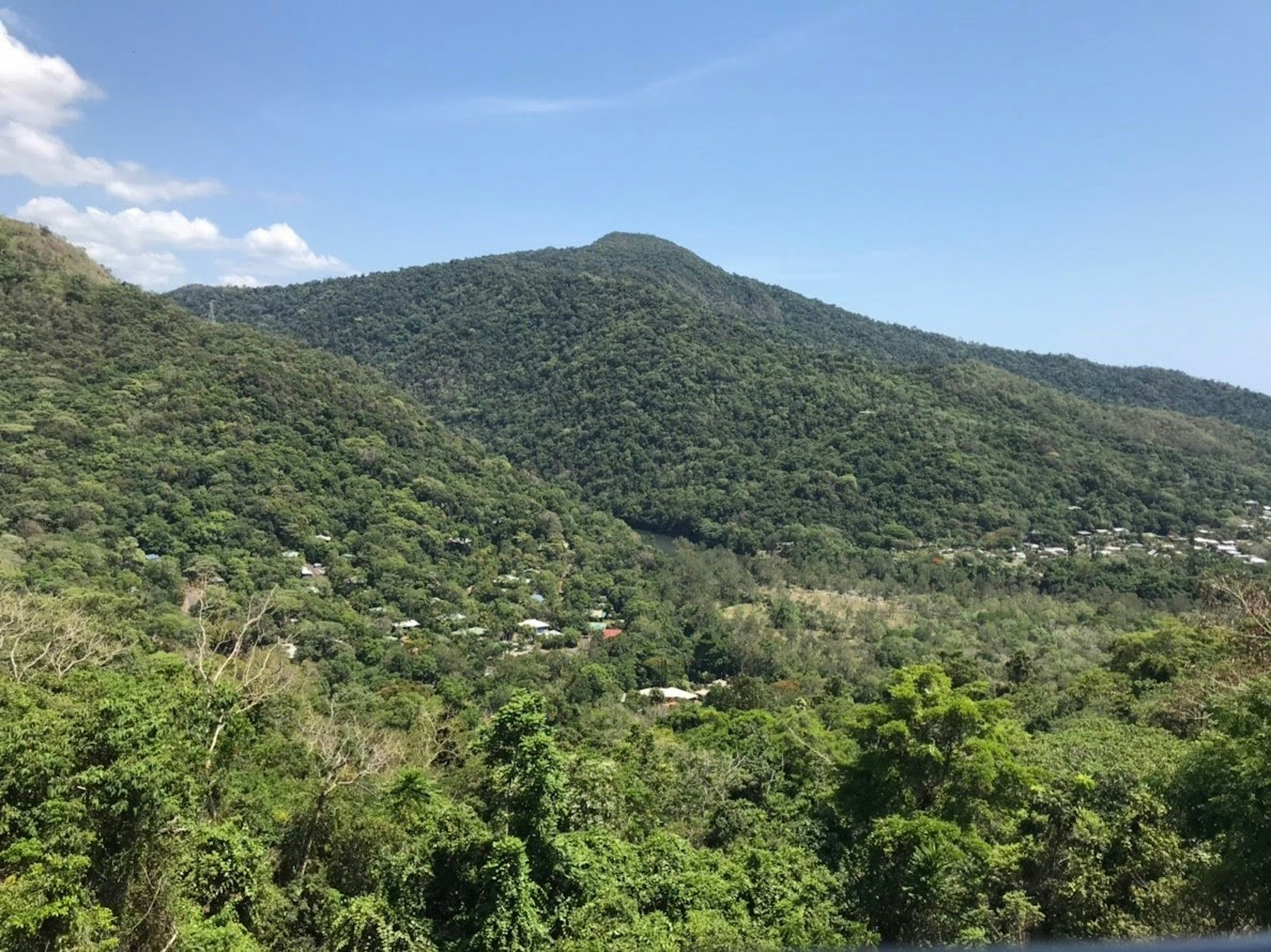 Lush green mountains under a clear blue sky