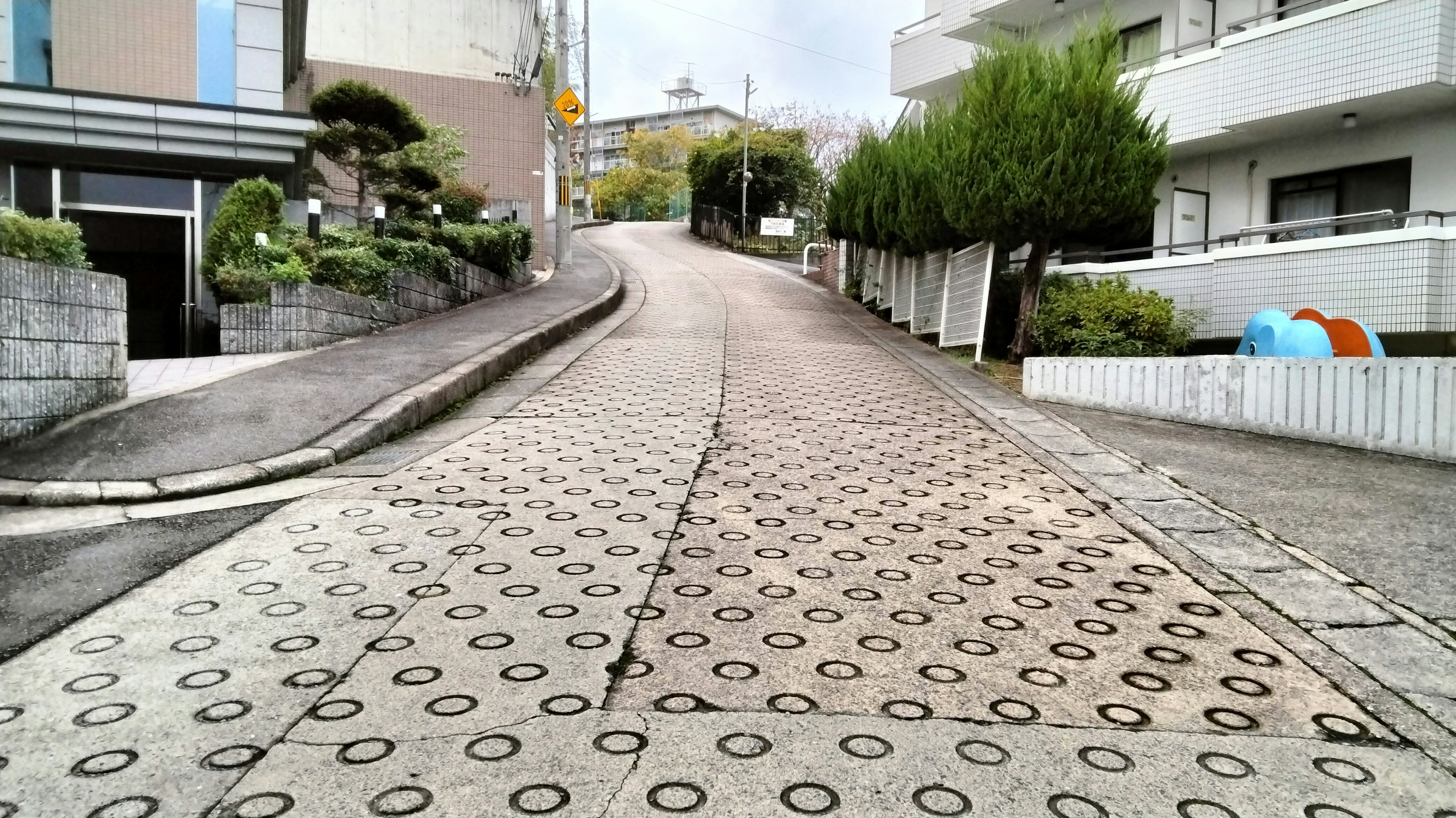 Sloped road with distinctive patterned pavement