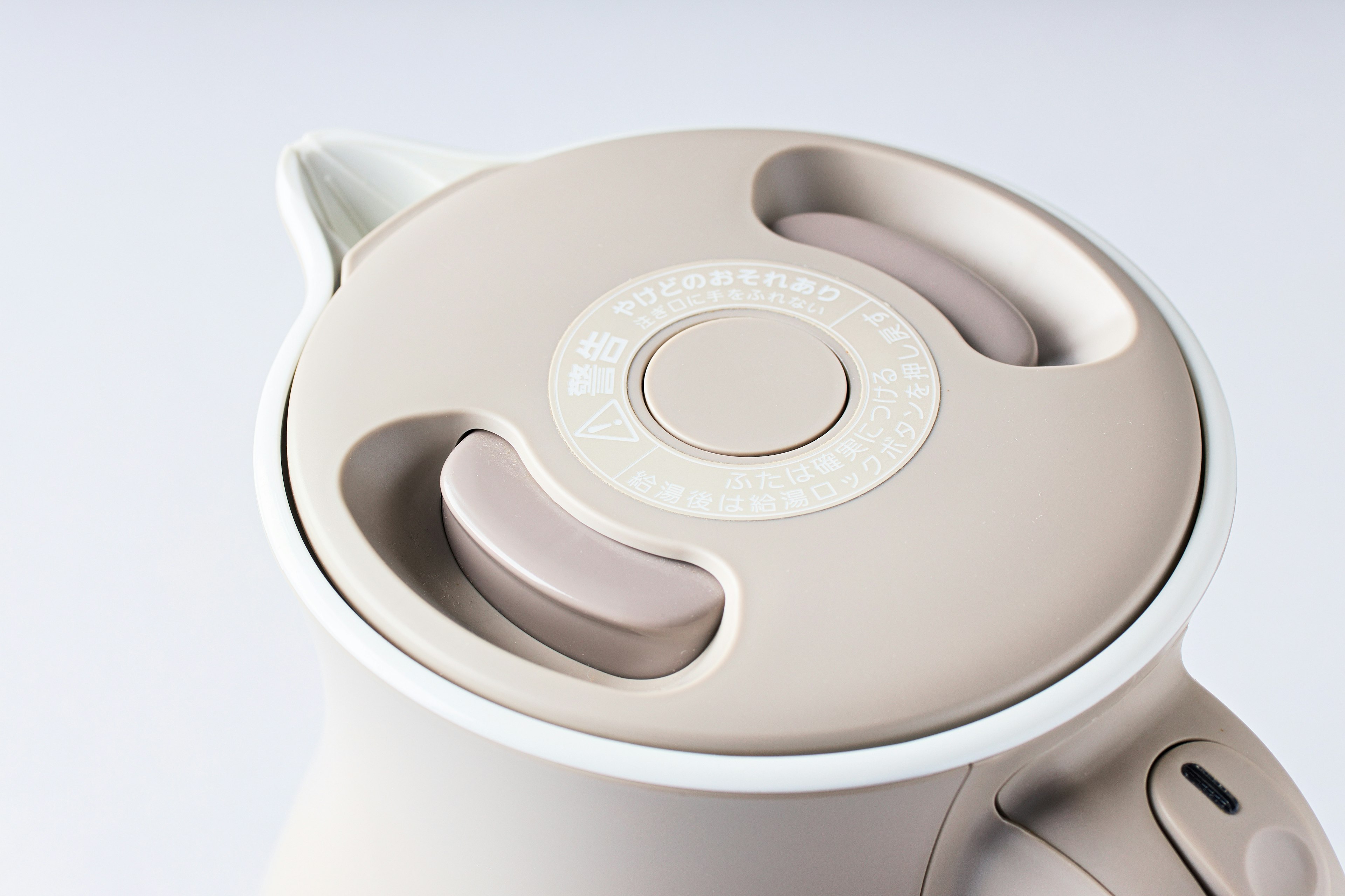 Top view of a light-colored electric kettle lid design