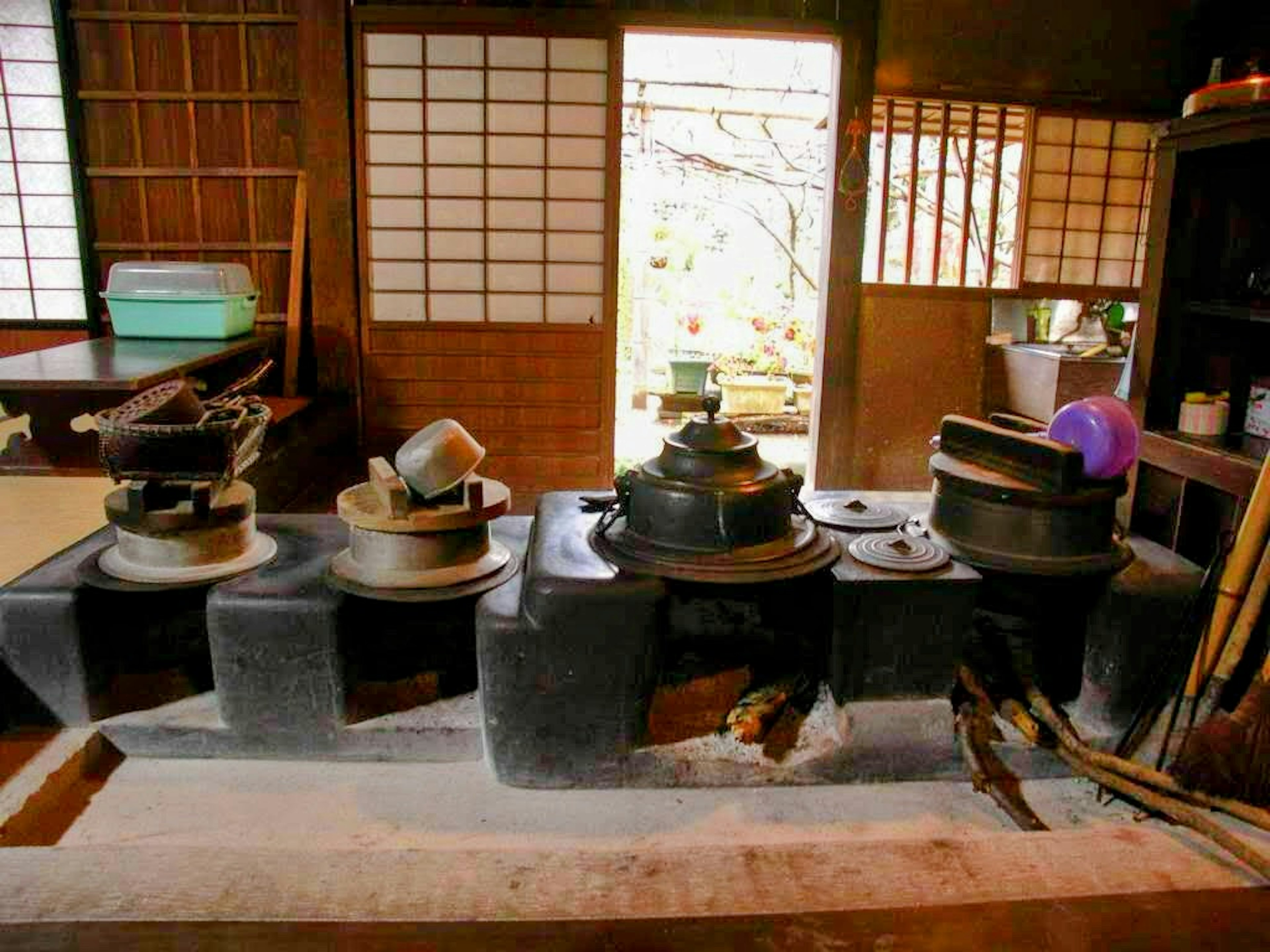 Traditional cooking utensils arranged in an old Japanese kitchen