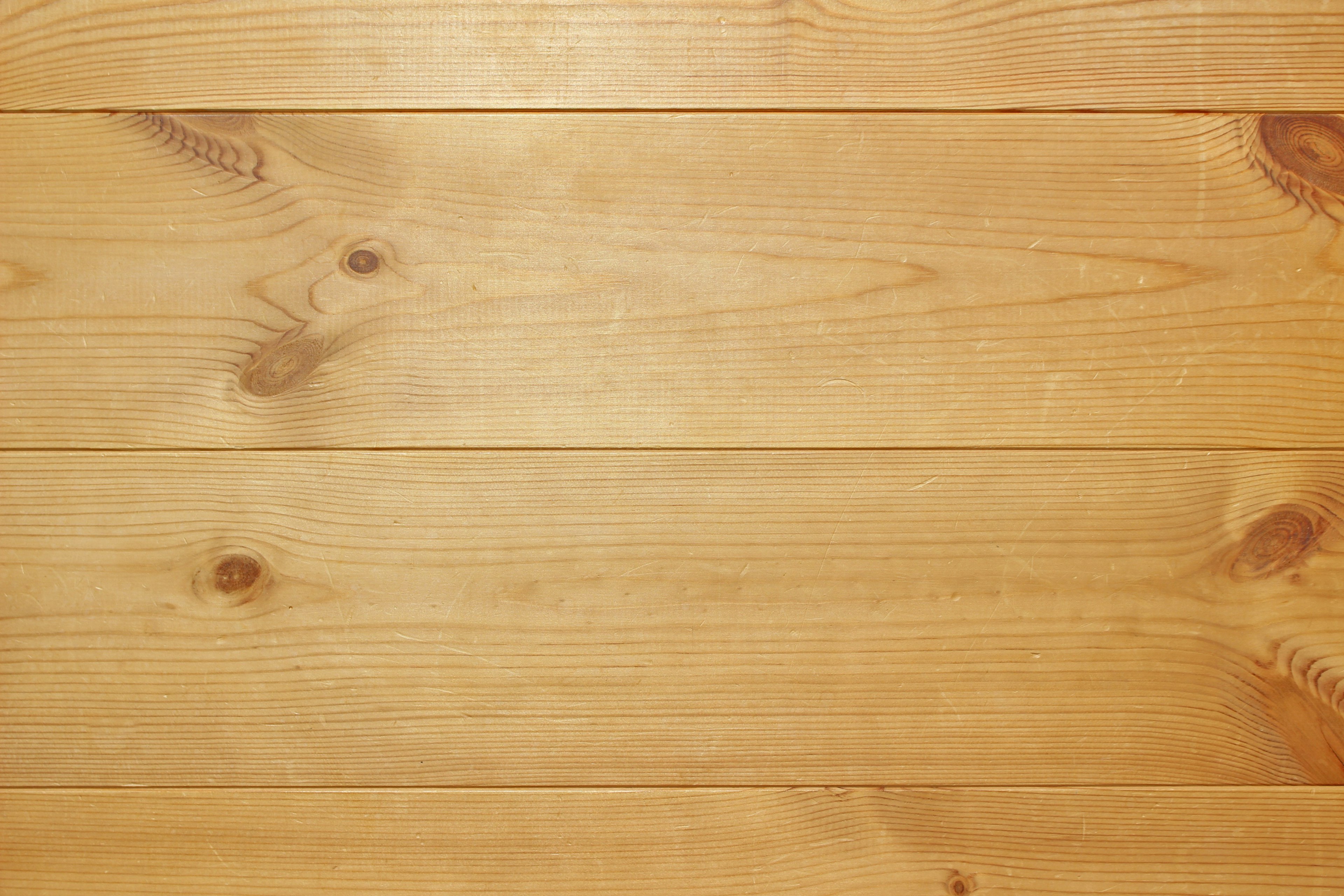 Wooden table surface with warm tones and distinct grain patterns