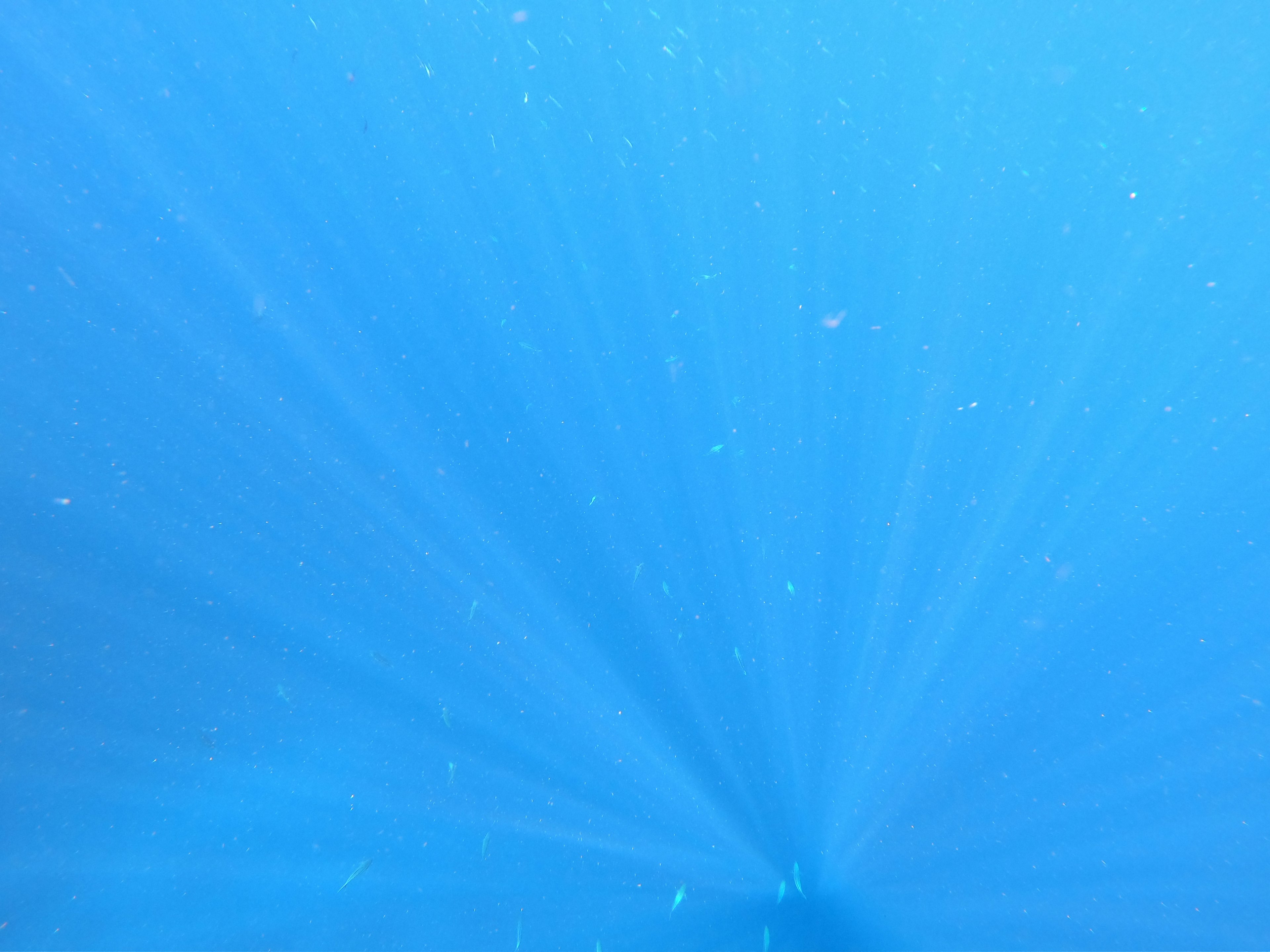 Radiating light in a blue water background