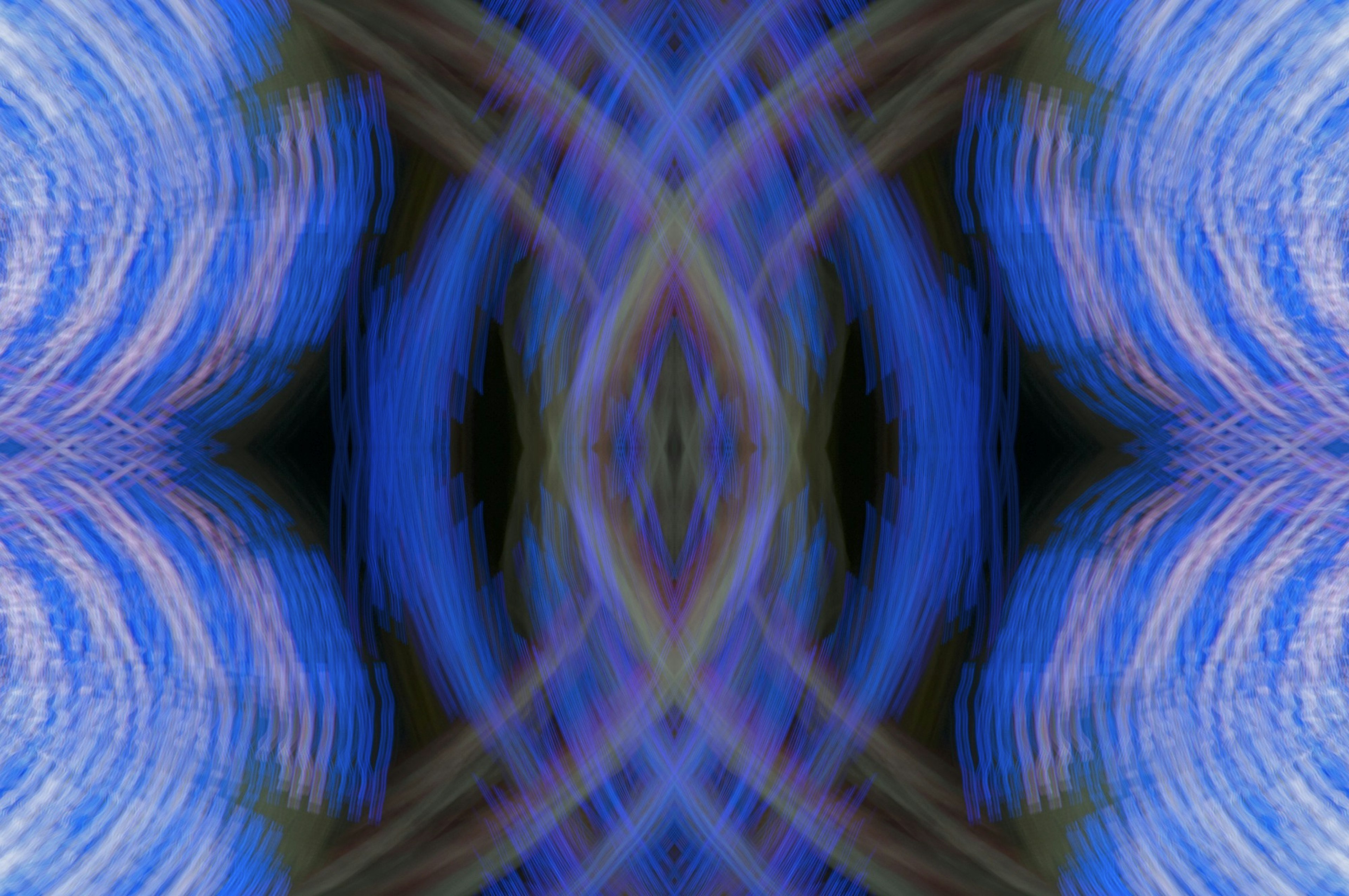 Abstract art featuring symmetrical blue wave patterns