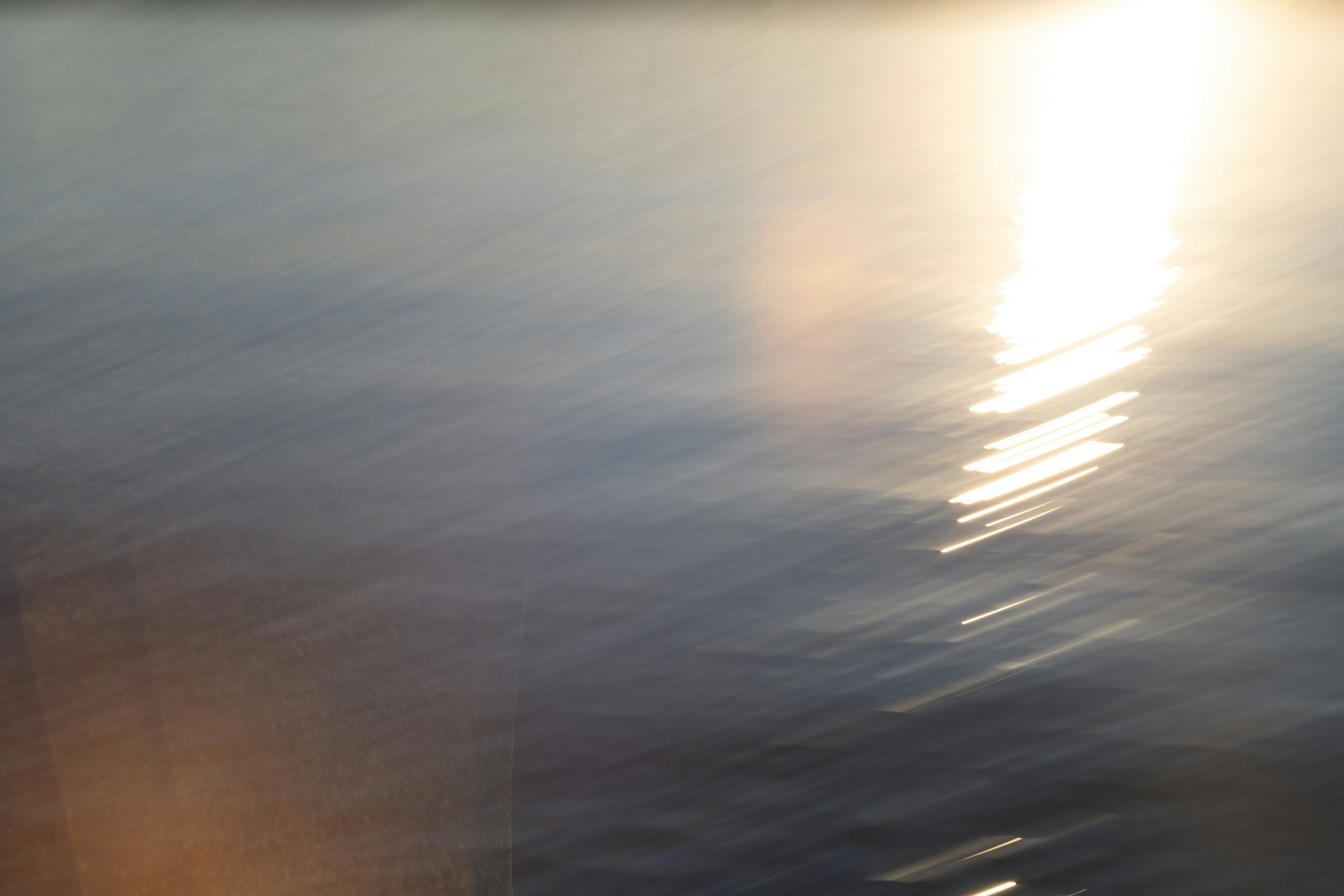 Blurred image of light reflecting on water surface