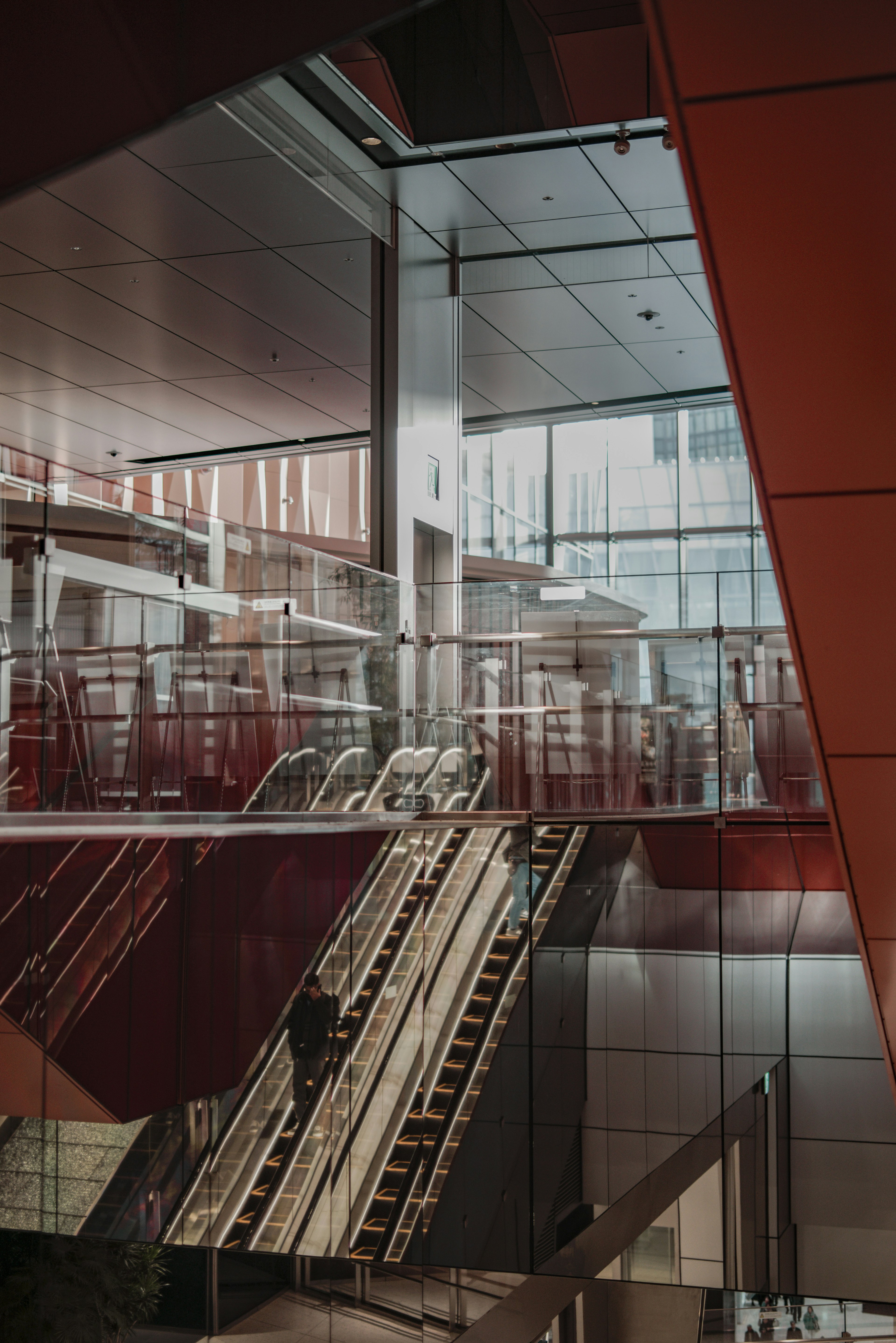 Interior view of a modern building featuring glass walls and angular design