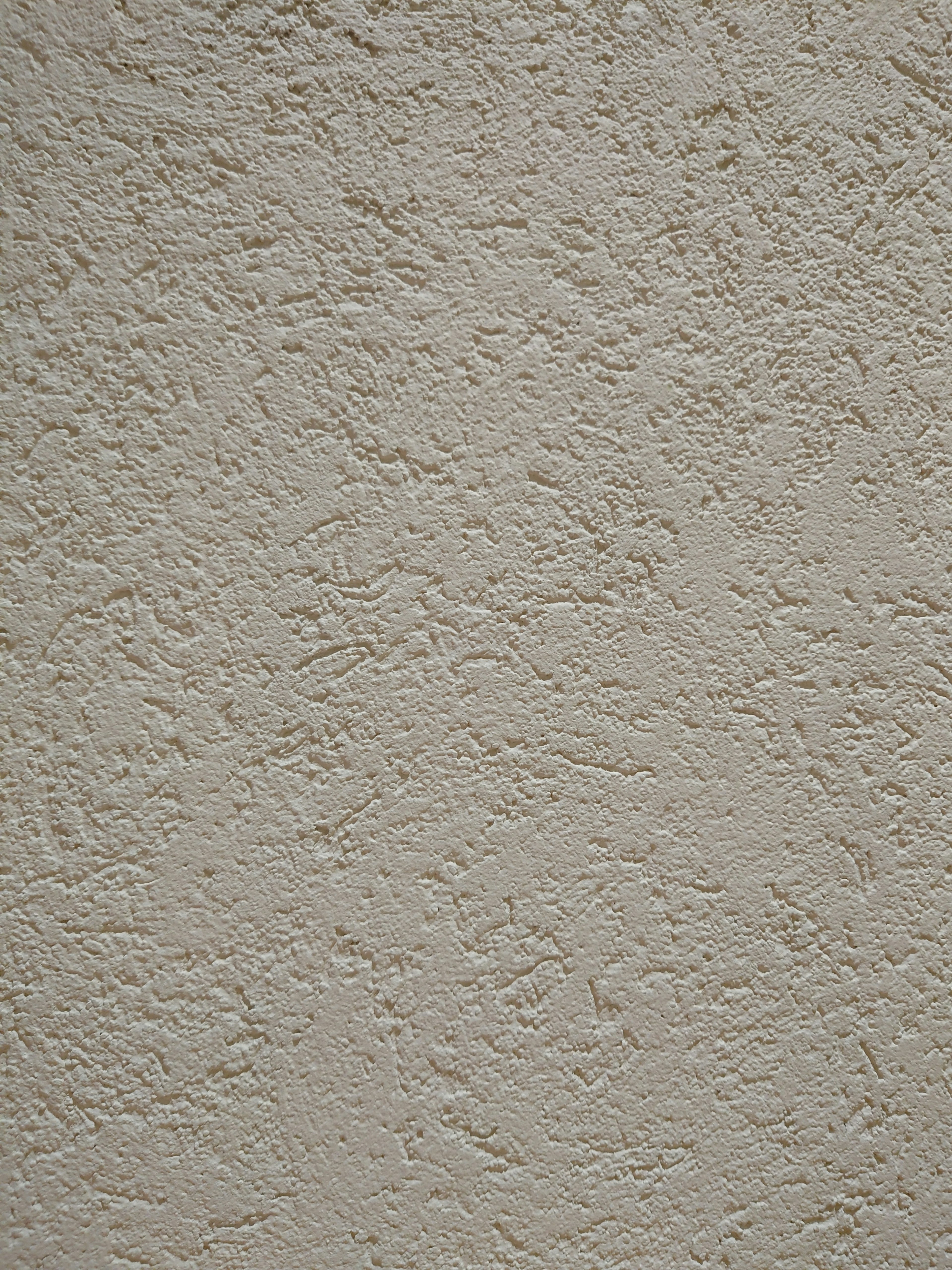 Close-up of a textured light gray wall