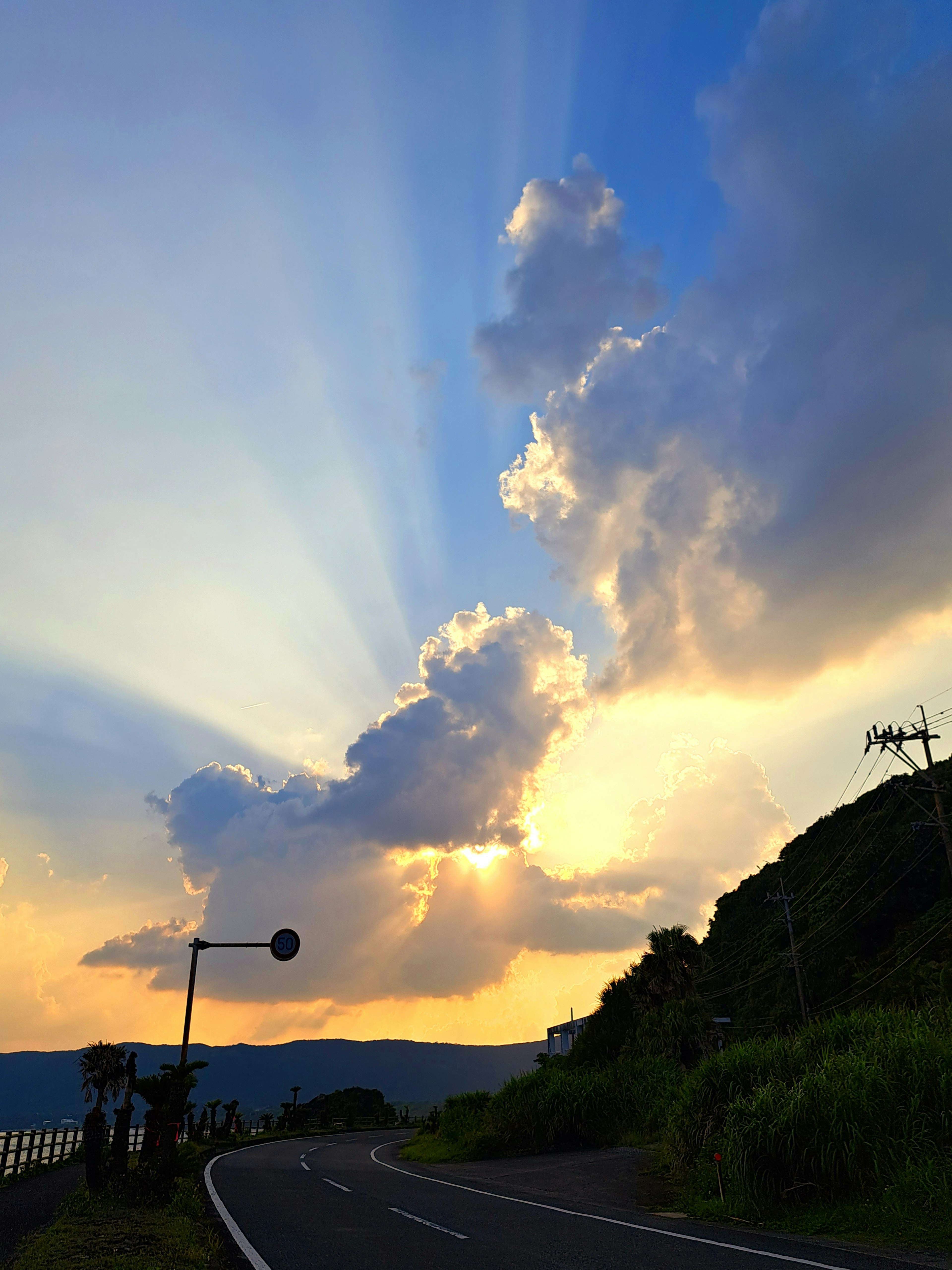 Beautiful landscape of clouds with rays of light in a blue sky