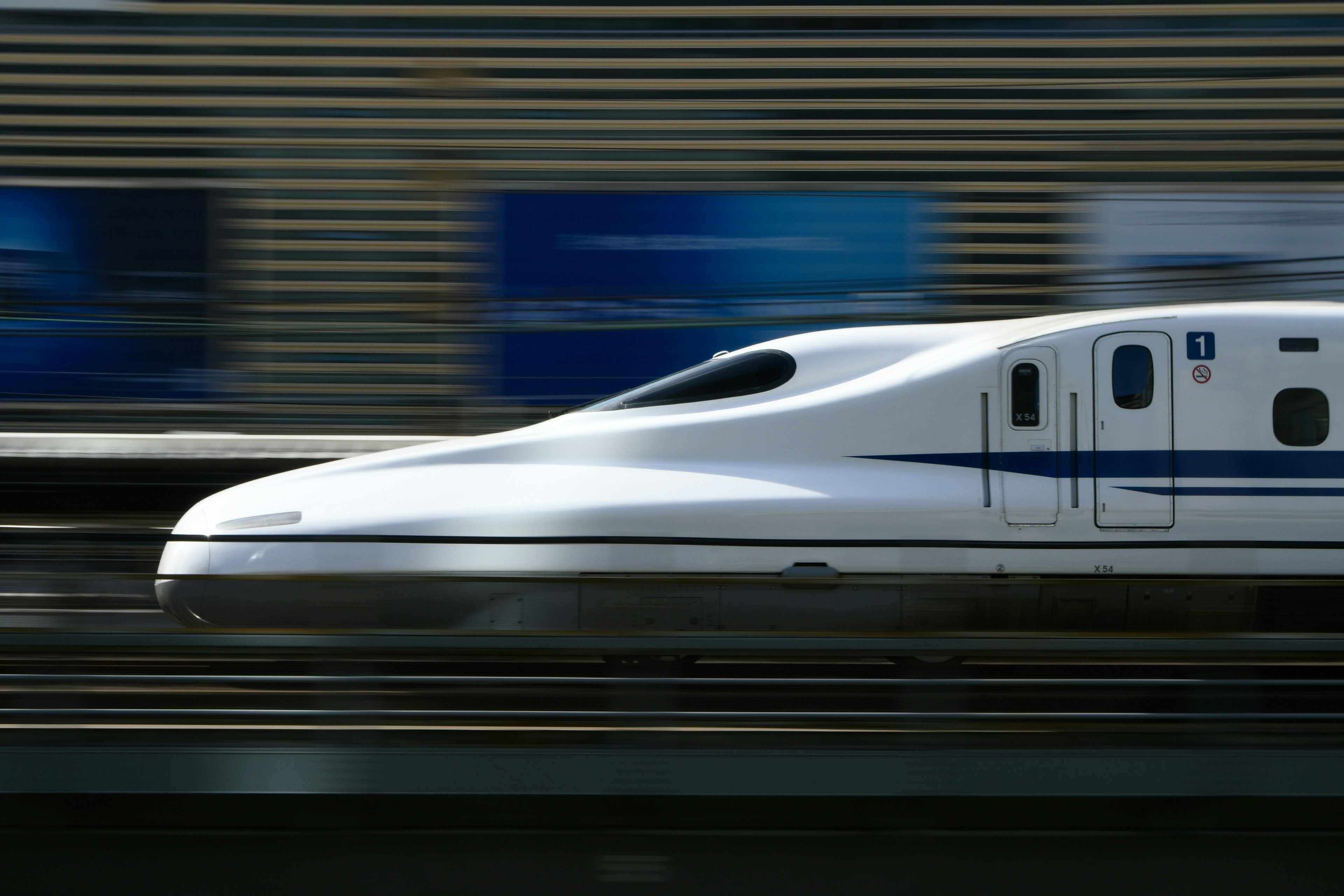 Shinkansen speeding along the tracks