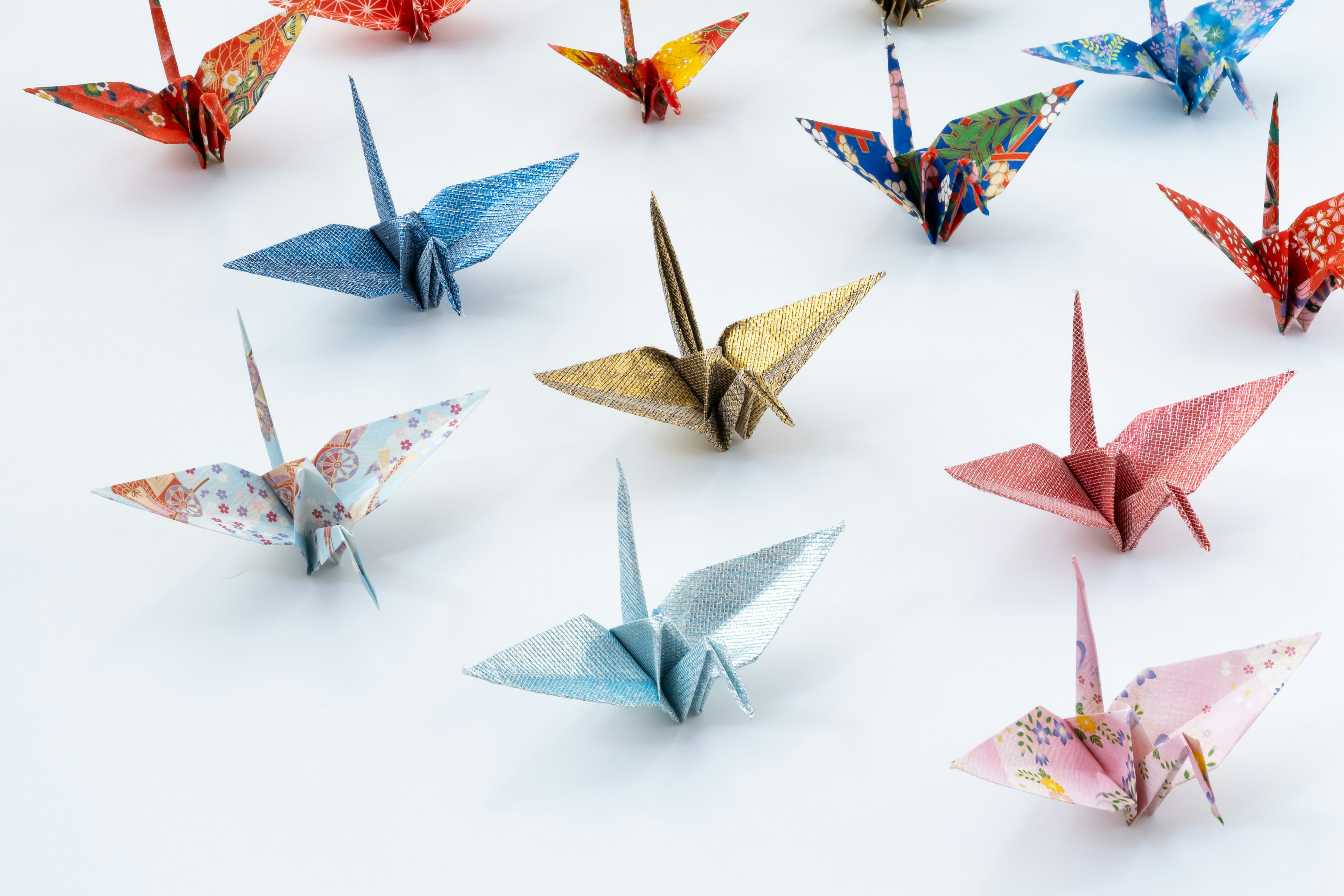 Colorful origami cranes arranged in a decorative display