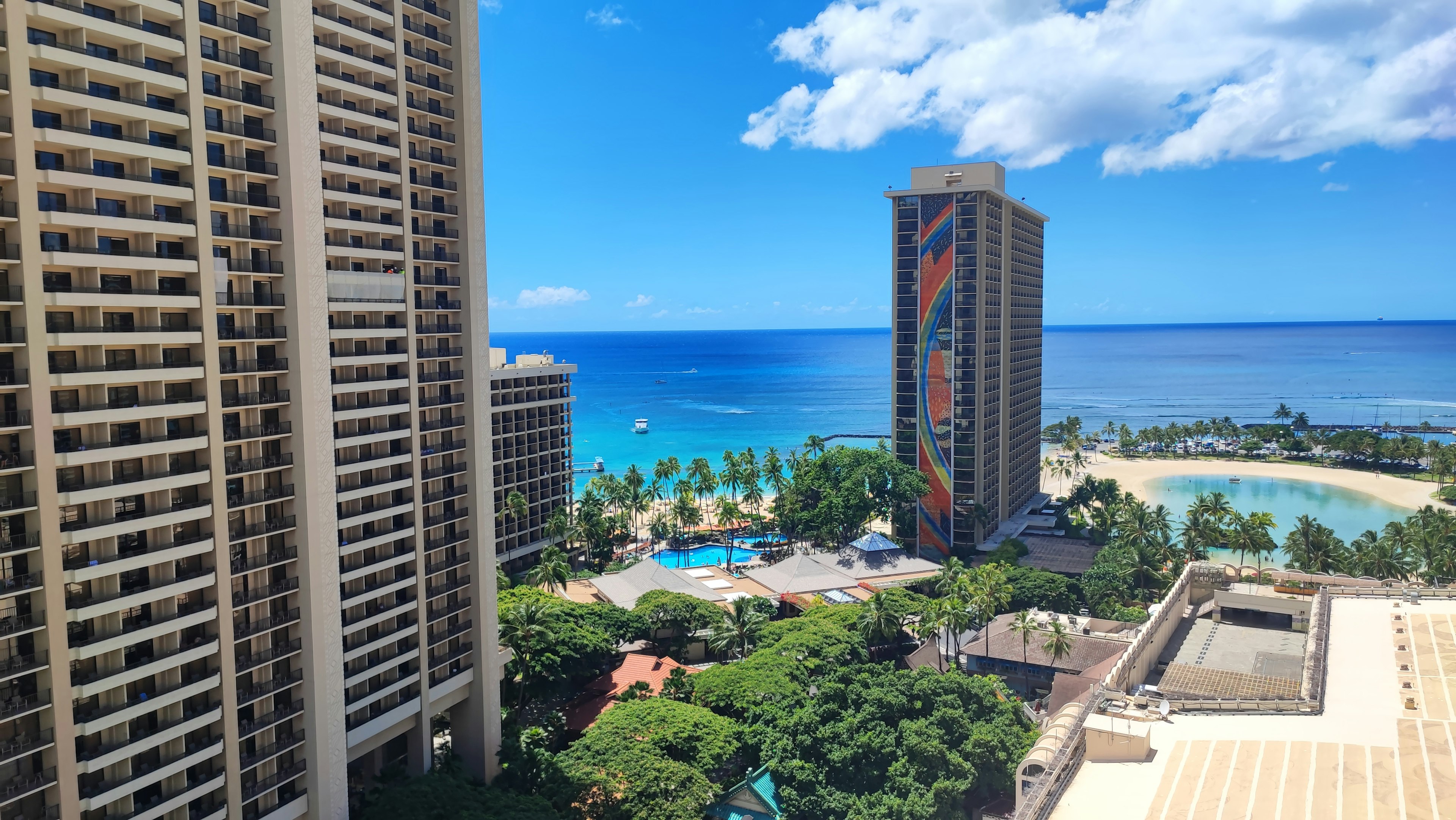 View of the ocean and beach in Hawaii from a high-rise building