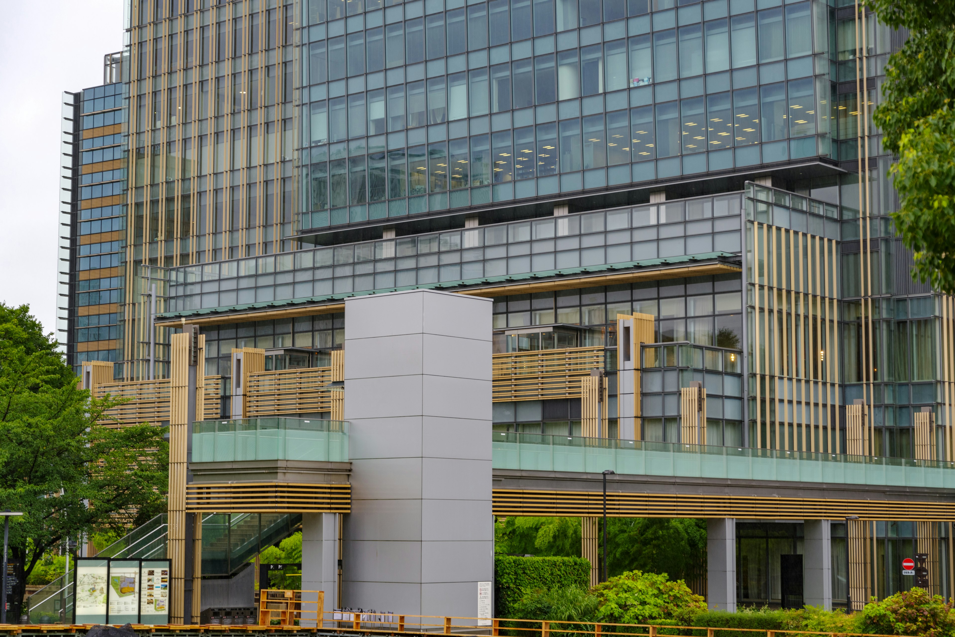 Modern office building exterior with lush greenery