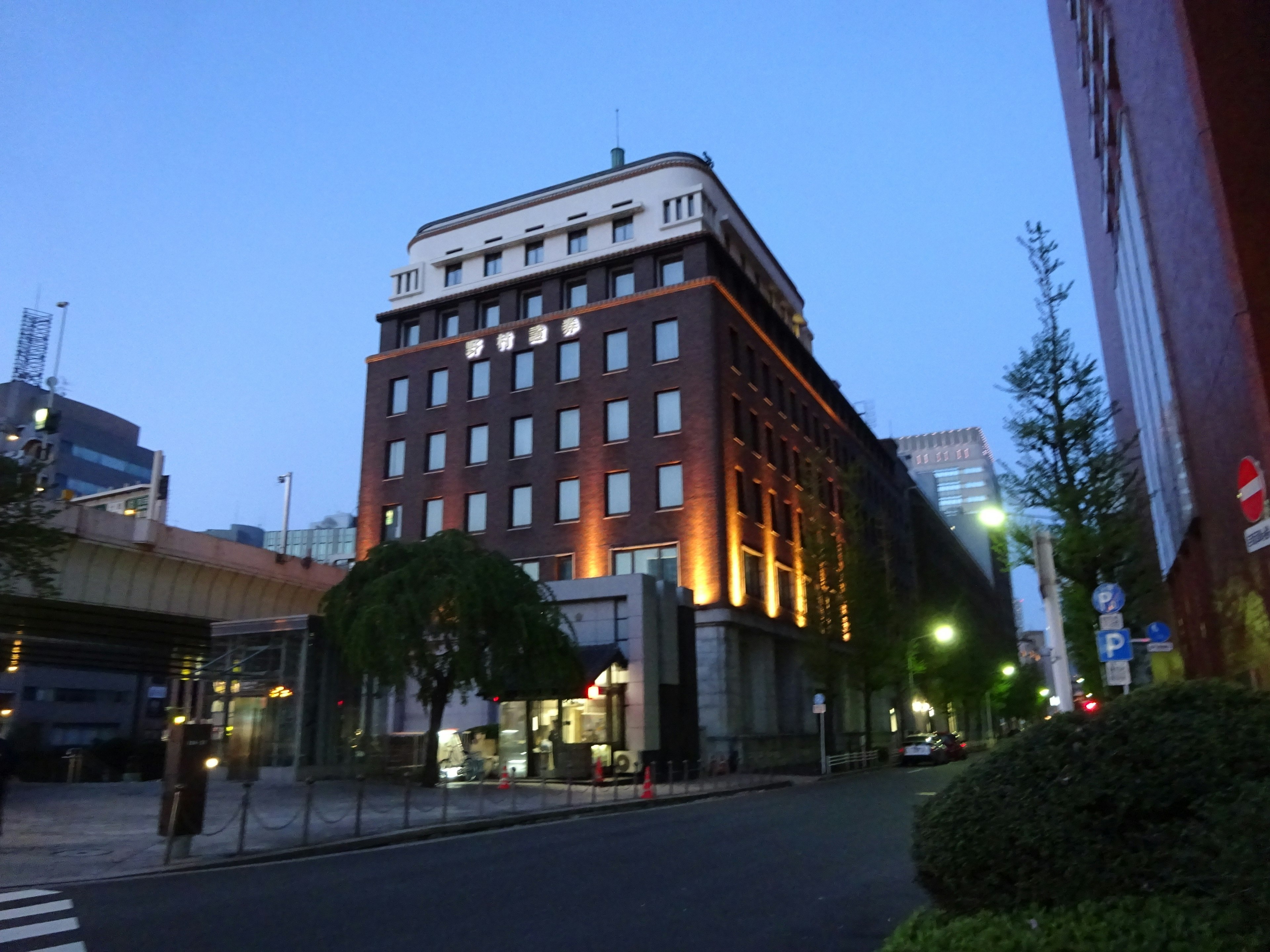 Historic brown building illuminated at night in urban setting