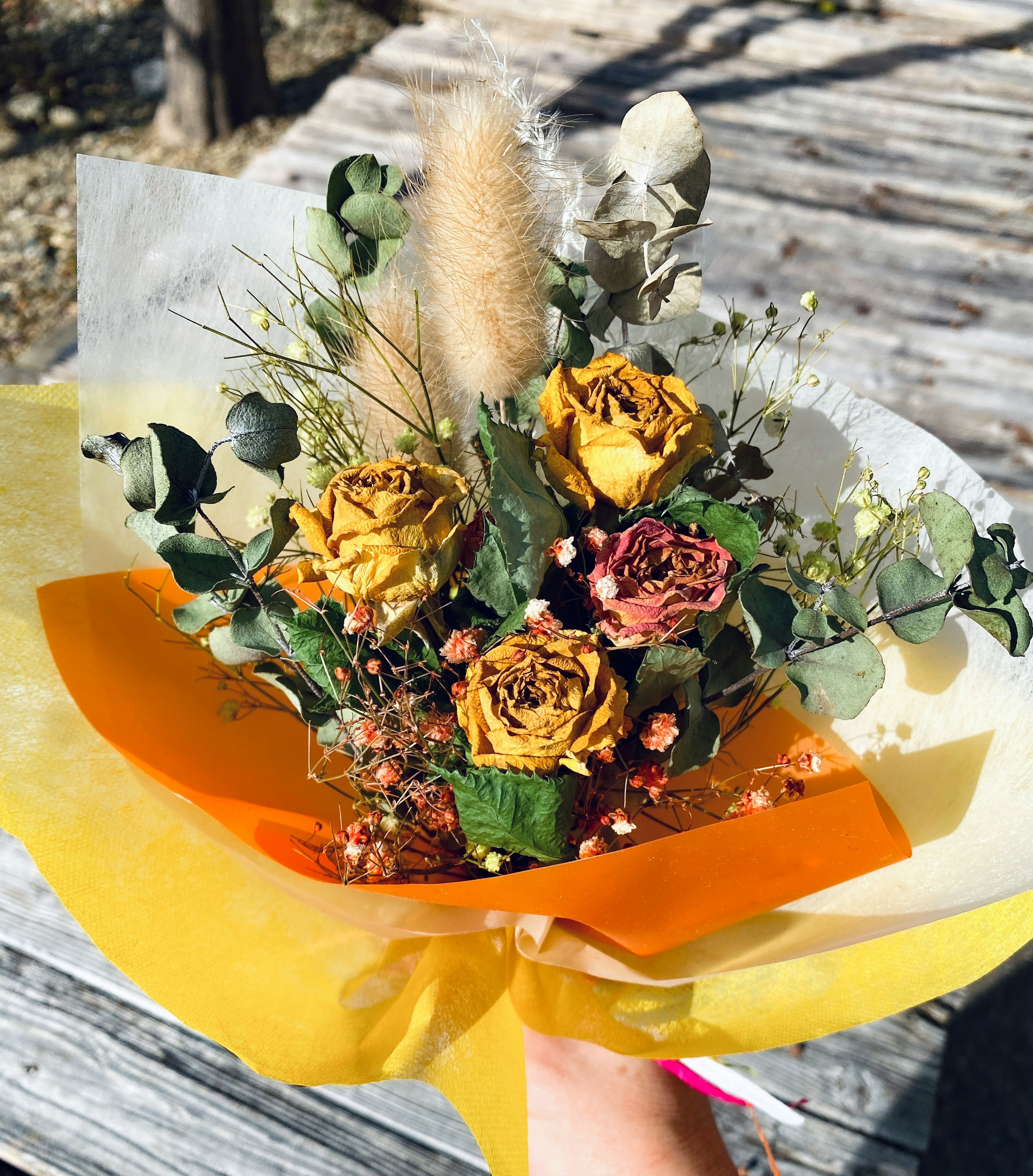 Bouquet of yellow roses and dried flowers