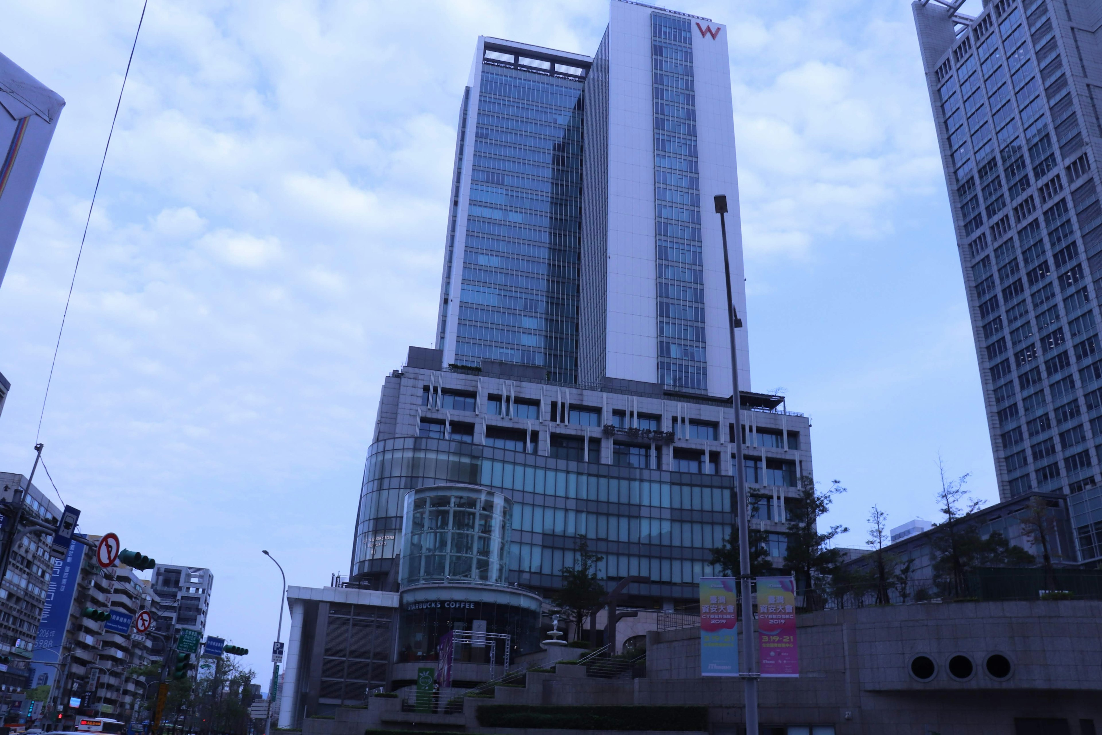 Modern skyscraper against a blue sky in an urban setting