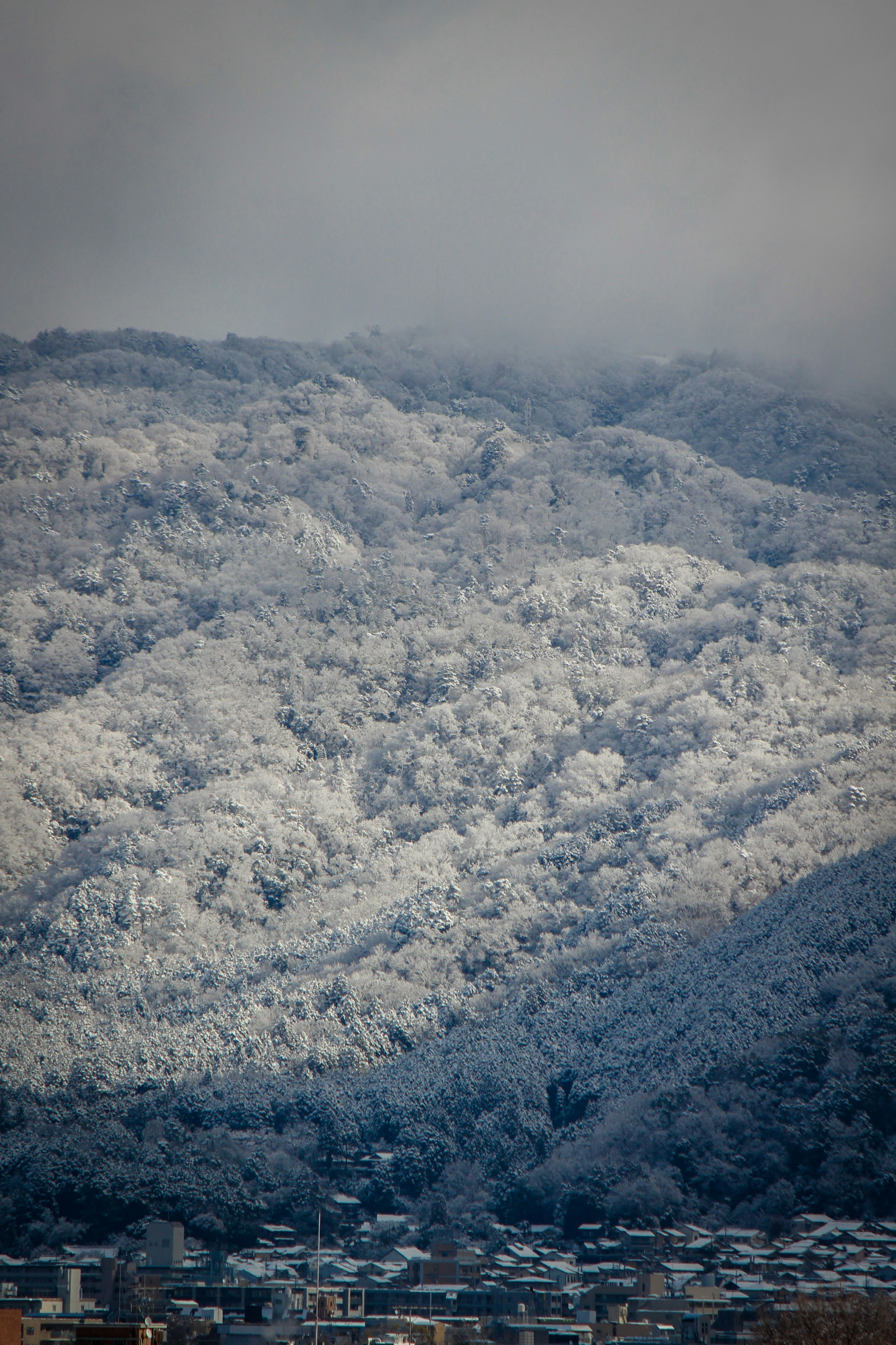 Snow-covered mountains with misty atmosphere