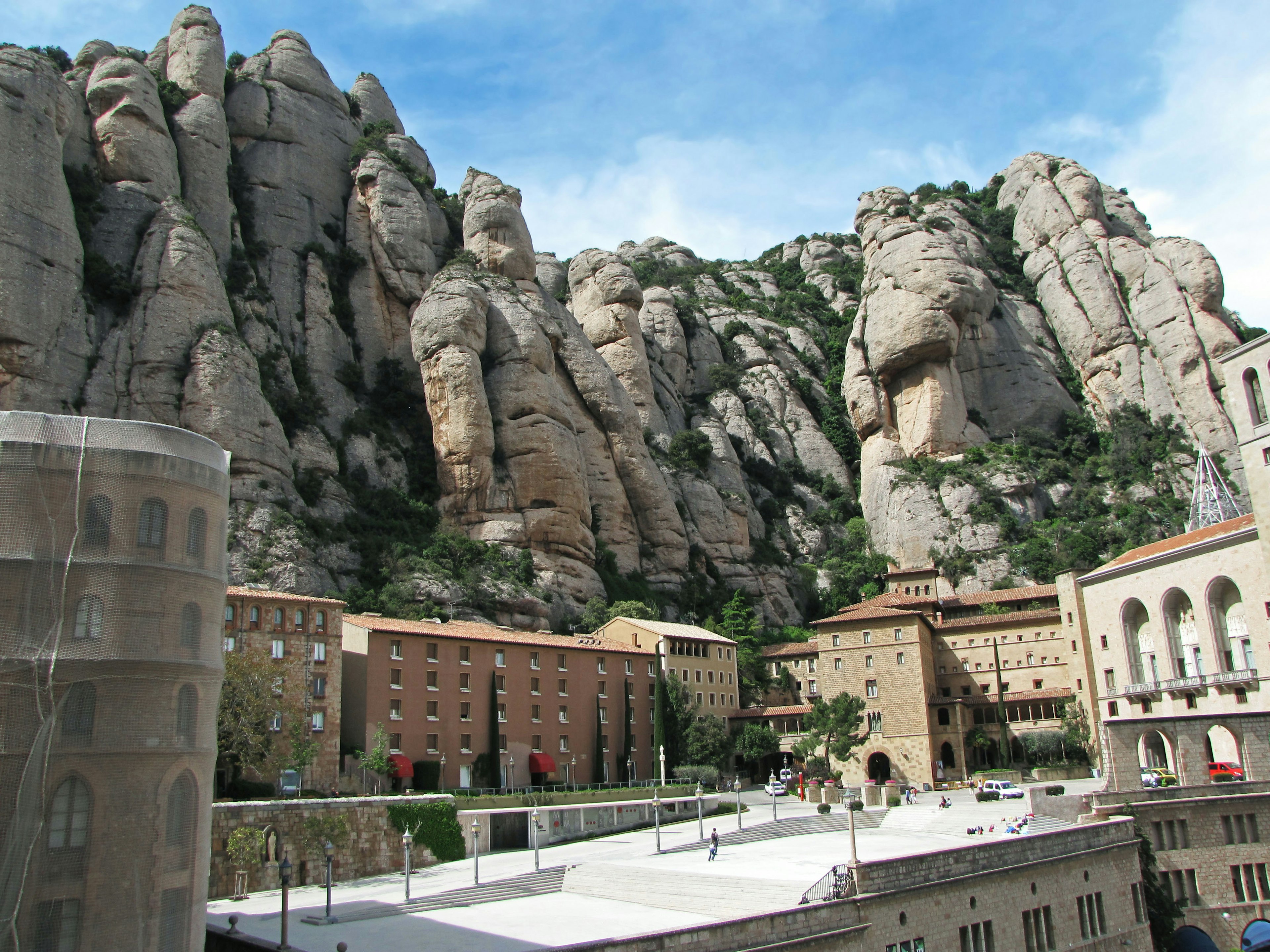 Majestic rock formations of Montserrat mountain with monastery buildings