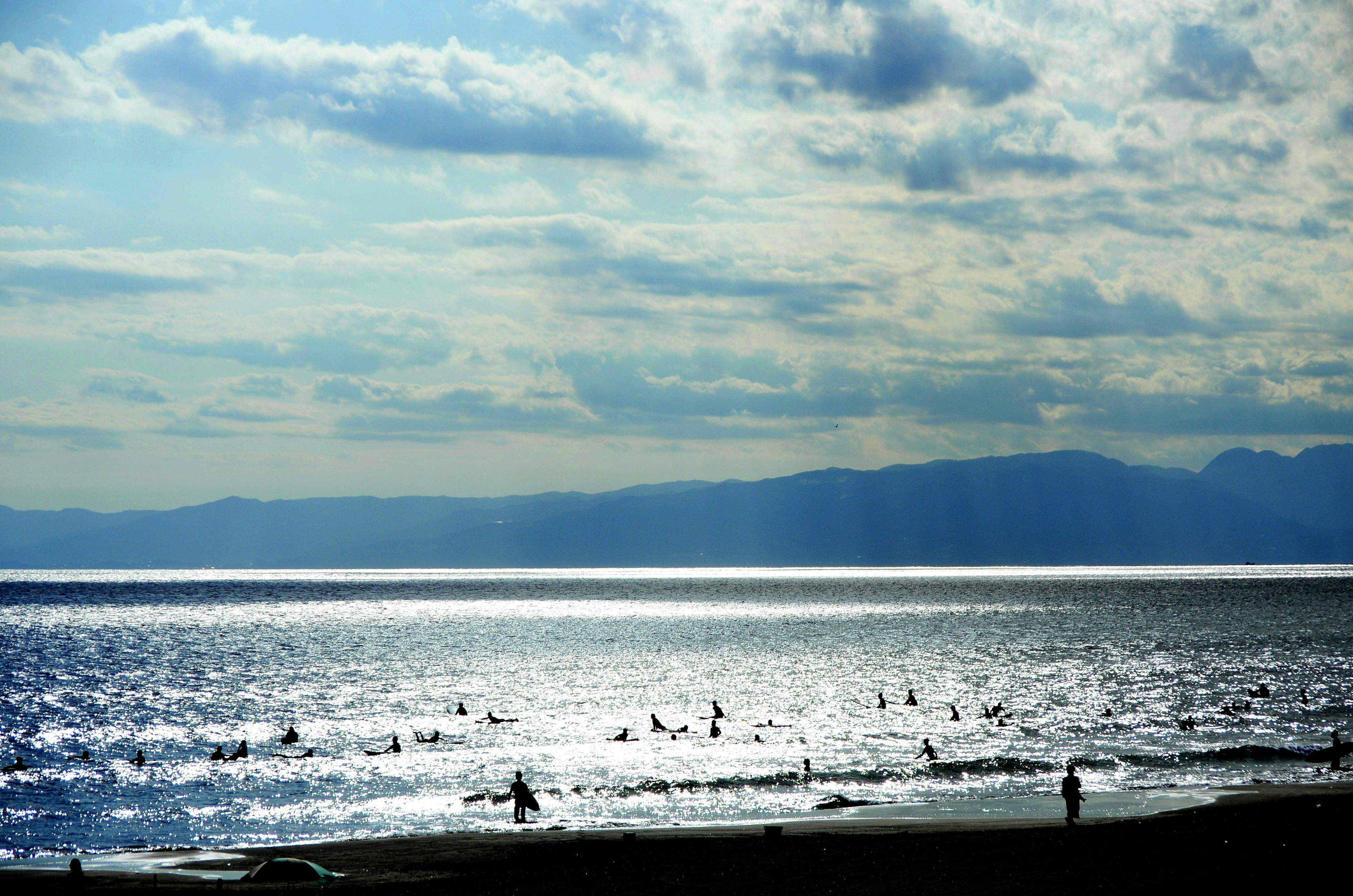 Beautiful seascape with people surfing in the ocean