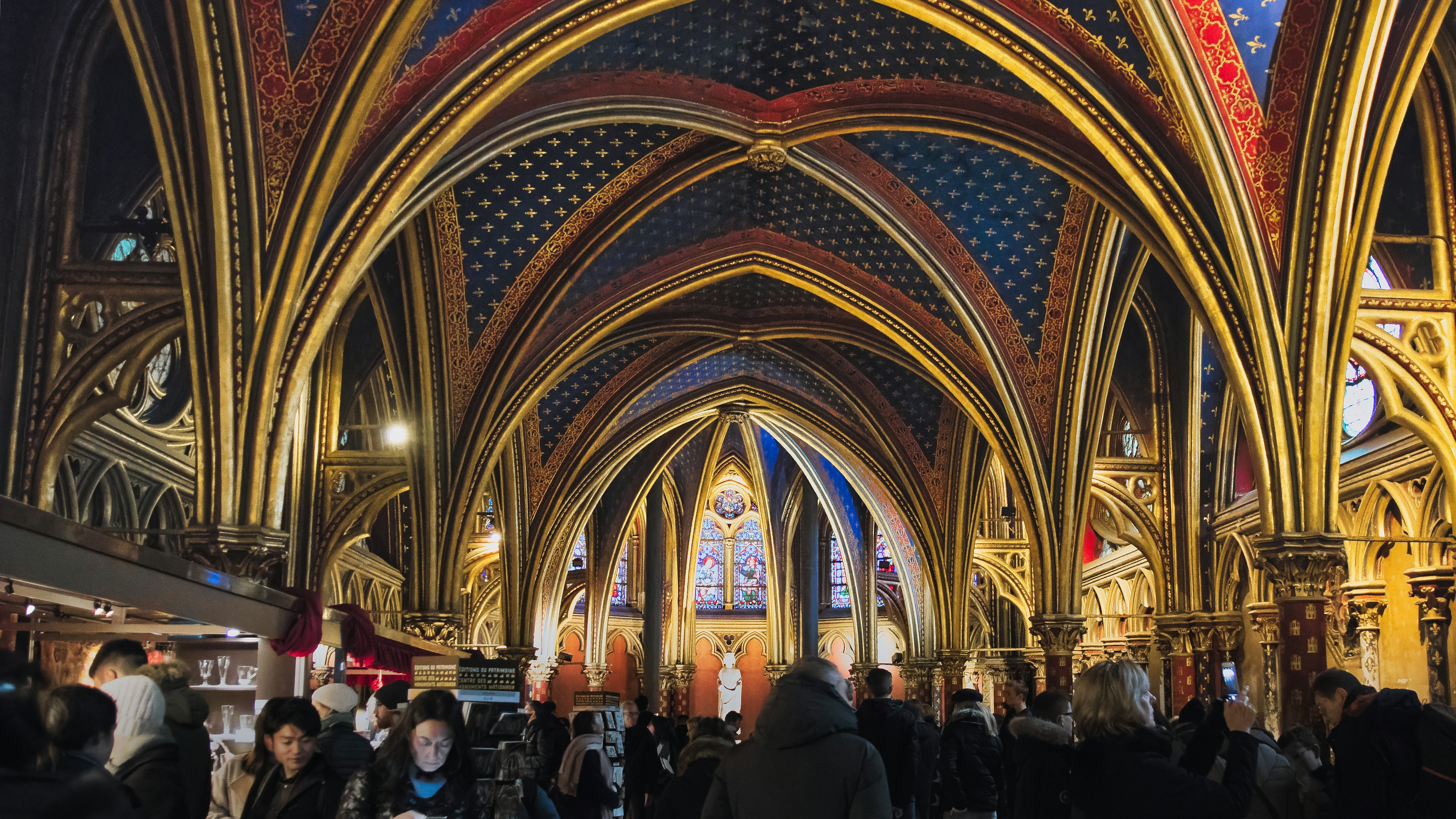 Interior of a beautiful Gothic church with people gathered